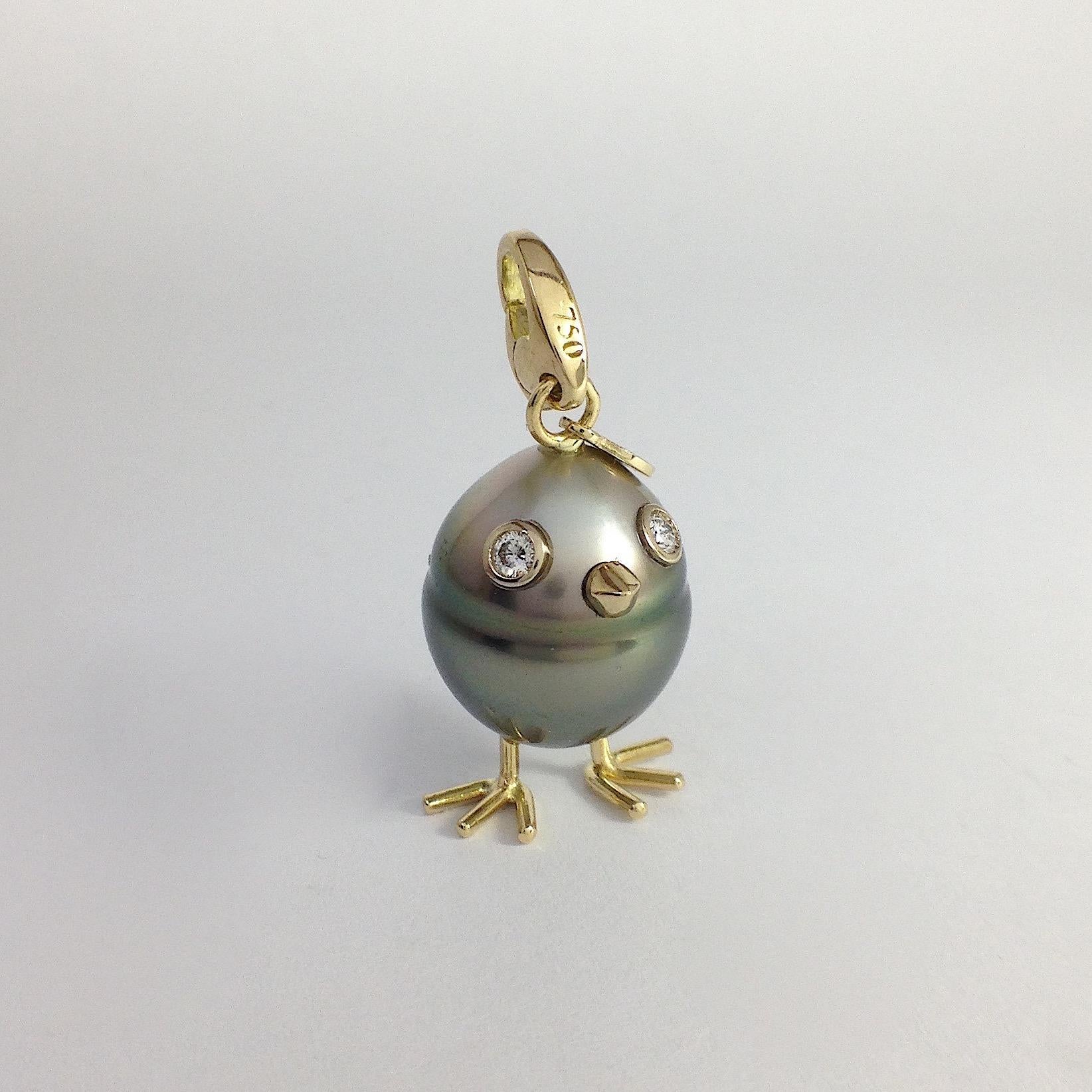 Chick South Sea Pearl White Diamond Gold 18 Kt Pendant Necklace or Charm
A beautiful Tahitian pearl has been carefully crafted to make a chick. He has his two legs, two eyes encrusted with two white diamonds and his beak. 
The gold is white for the