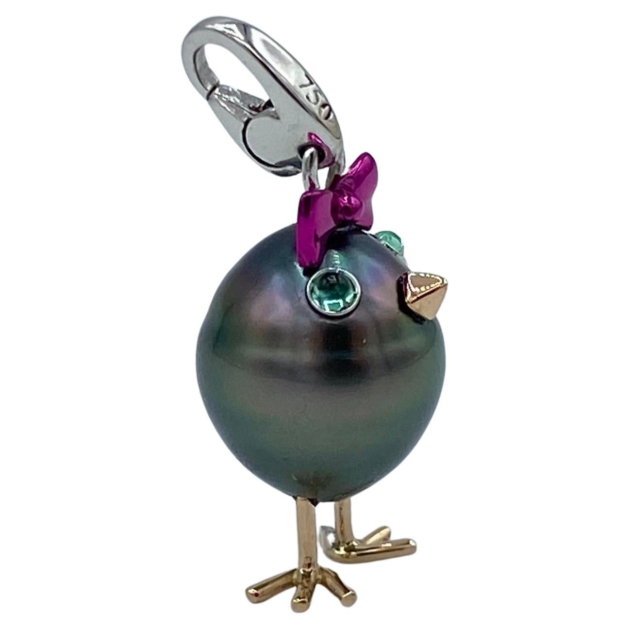 Chick Tahitian Pearl Emerald White Red 18 Kt Gold Pendant Necklace and Charm
A very beautiful Tahitian pearl has been carefully crafted to make a chick. He has his two legs, two eyes encrusted with two emerald cabochon cut and his beak. 
The gold is
