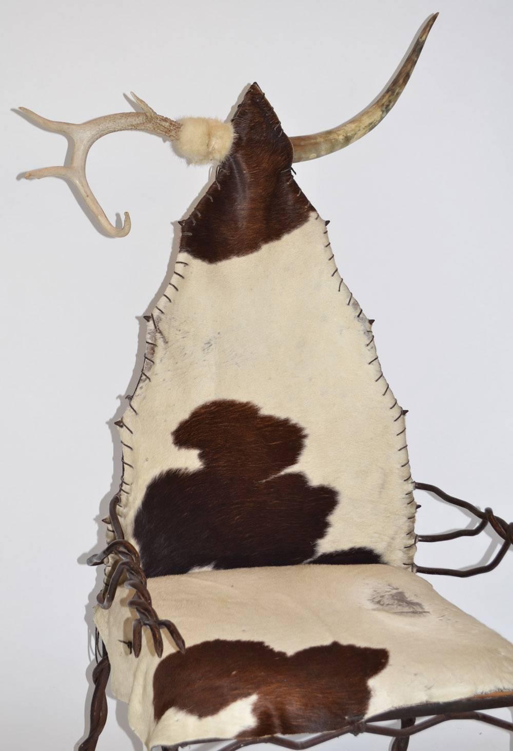 Western Arm or Lounge Chair in Wrought Iron Horn Antler and Cow Hide. One-off Miami Beach 1980's.
Unique, brutalist bizarre, fantasy sculptural furniture ‘Chieftan’ chair in wrought iron, horn, antler and hide reminiscent of the American West or