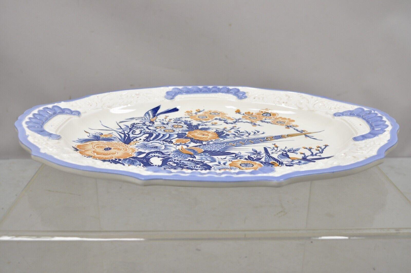 Chikusa Yokkaichi Japan blue white ceramic chinese bird platter dish plate. Item features a beautiful bird and flower scene to center, blue, white, and orange color, nice oval shape, original stamp, very nice vintage item. Circa mid-20th century.