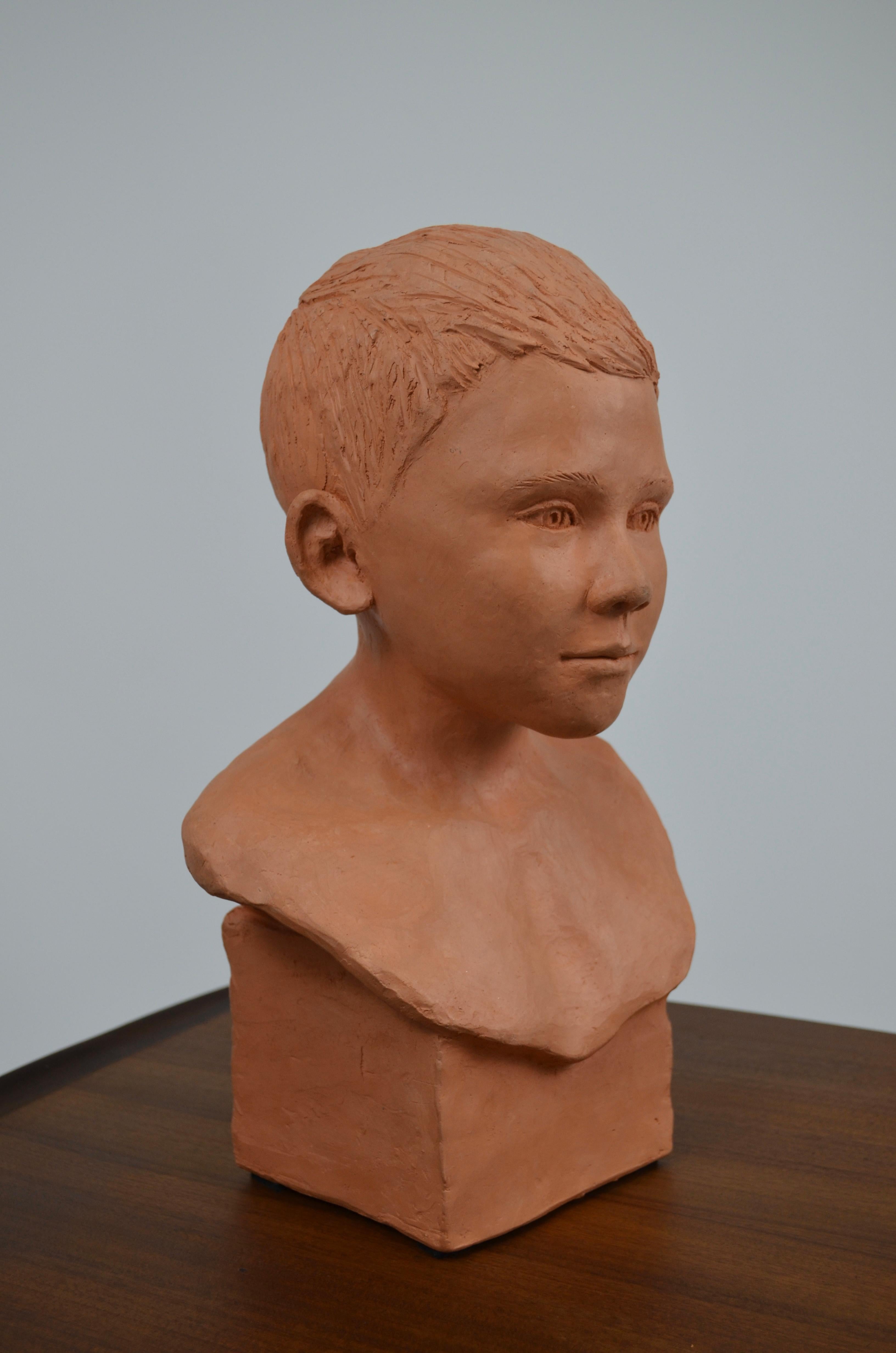 Contemporary child bust in terracotta For Sale