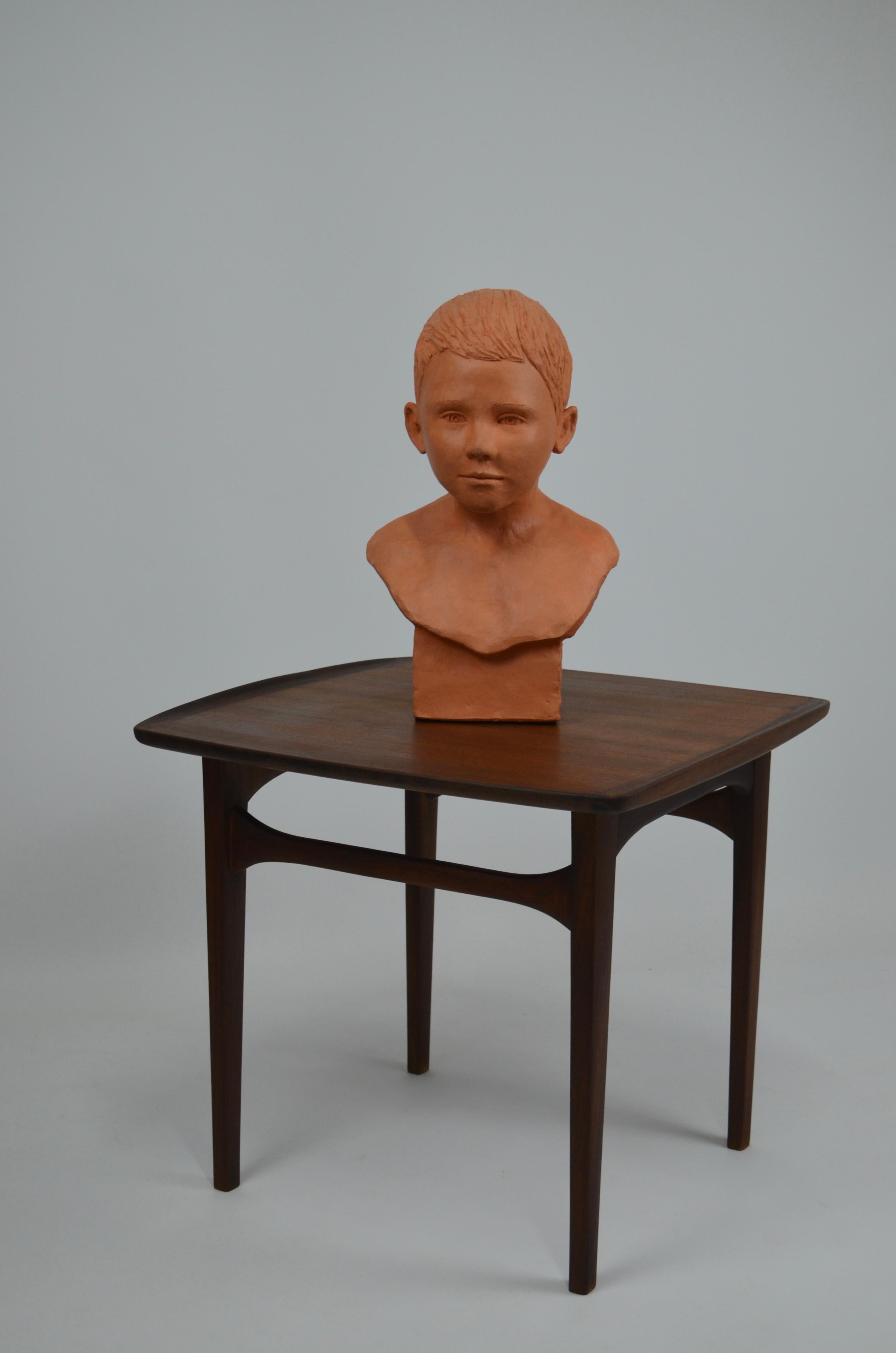 Terracotta child bust in terracotta For Sale