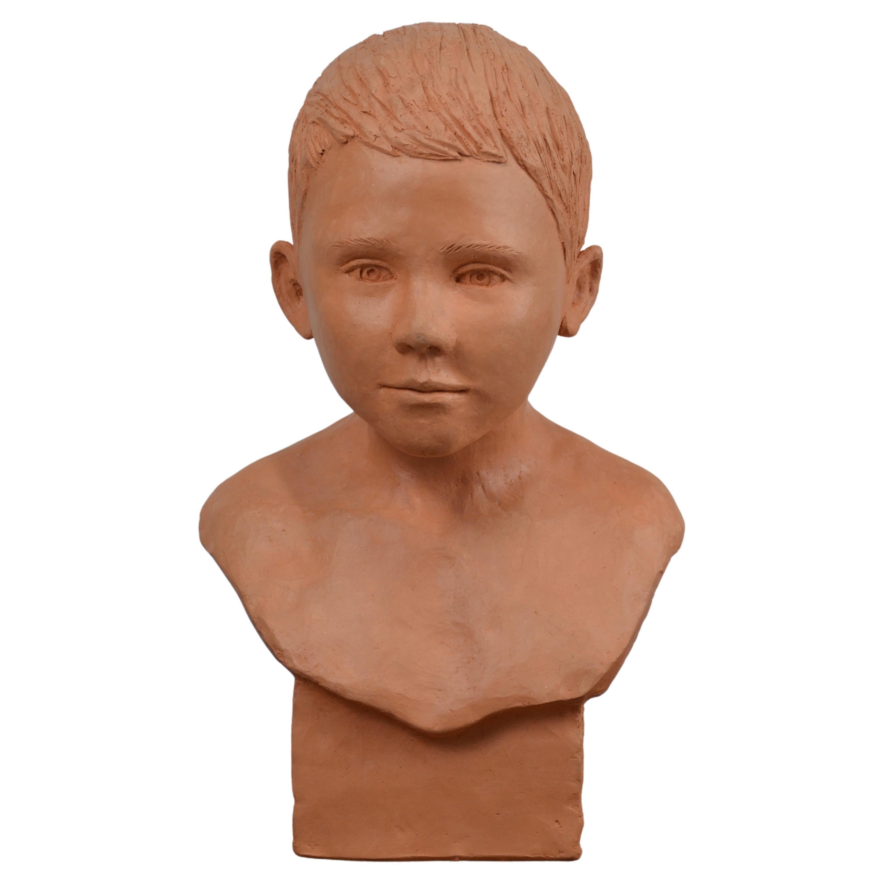 child bust in terracotta For Sale