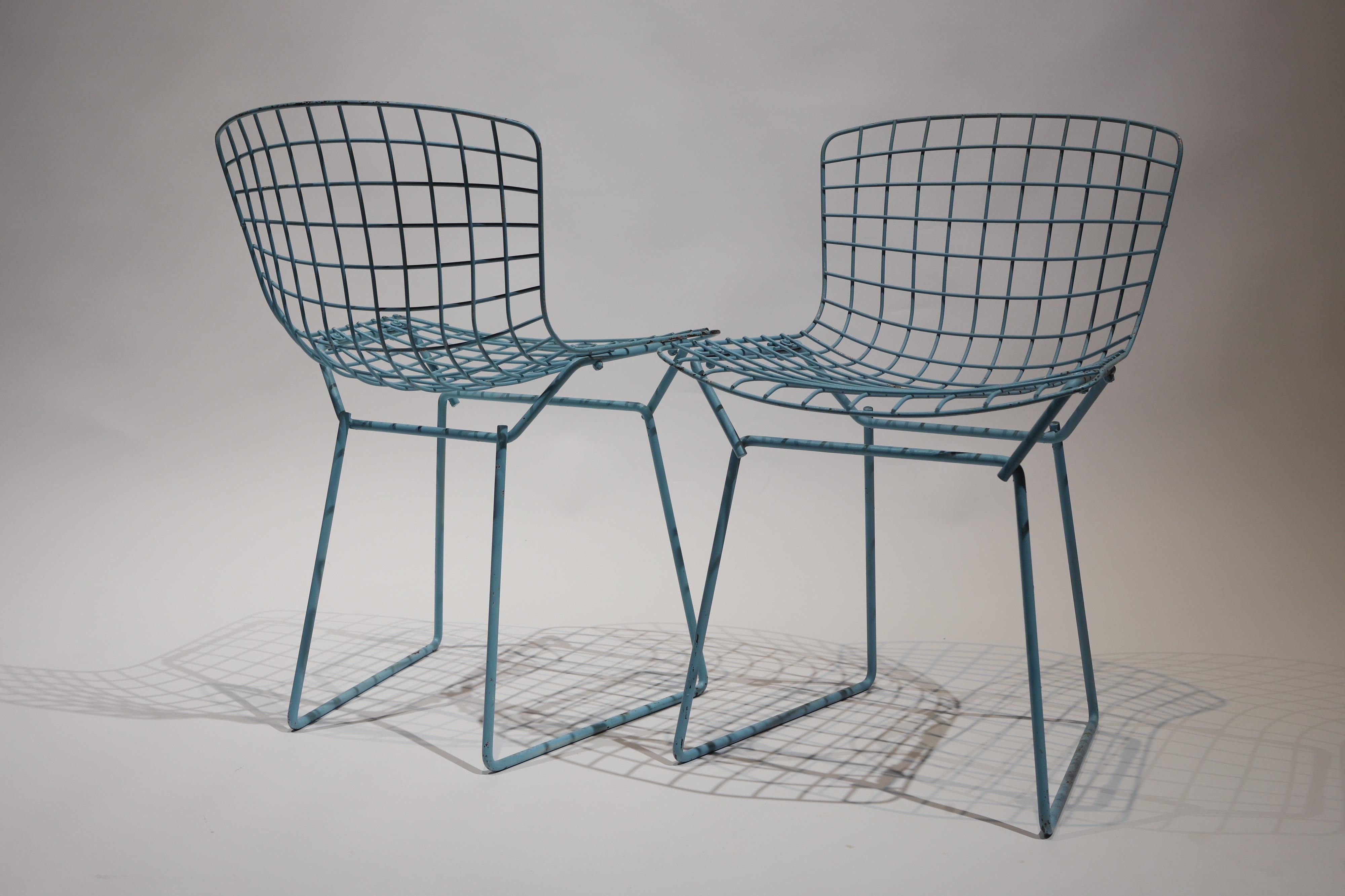 Wonderful set of child sized side chairs designed by Harry Bertoia for Knoll. Set was painted light blue at one point and have a wonderful patina. Pictured with Herman Miller fiberglass armchair by Charles and Ray Eames for scale.