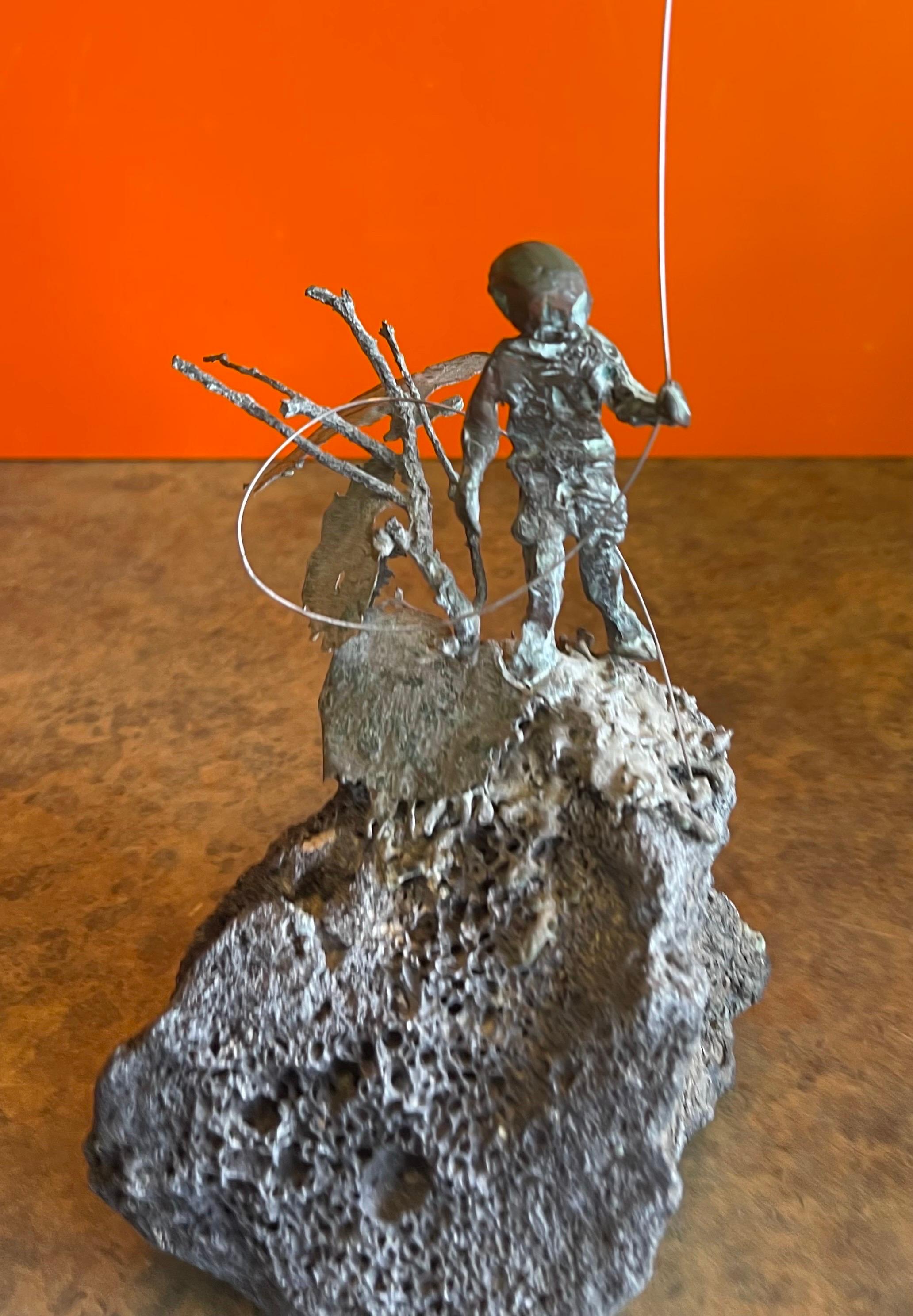 Child Flying Kite Bronze on Volcanic Rock Sculpture by Malcolm Moran 3
