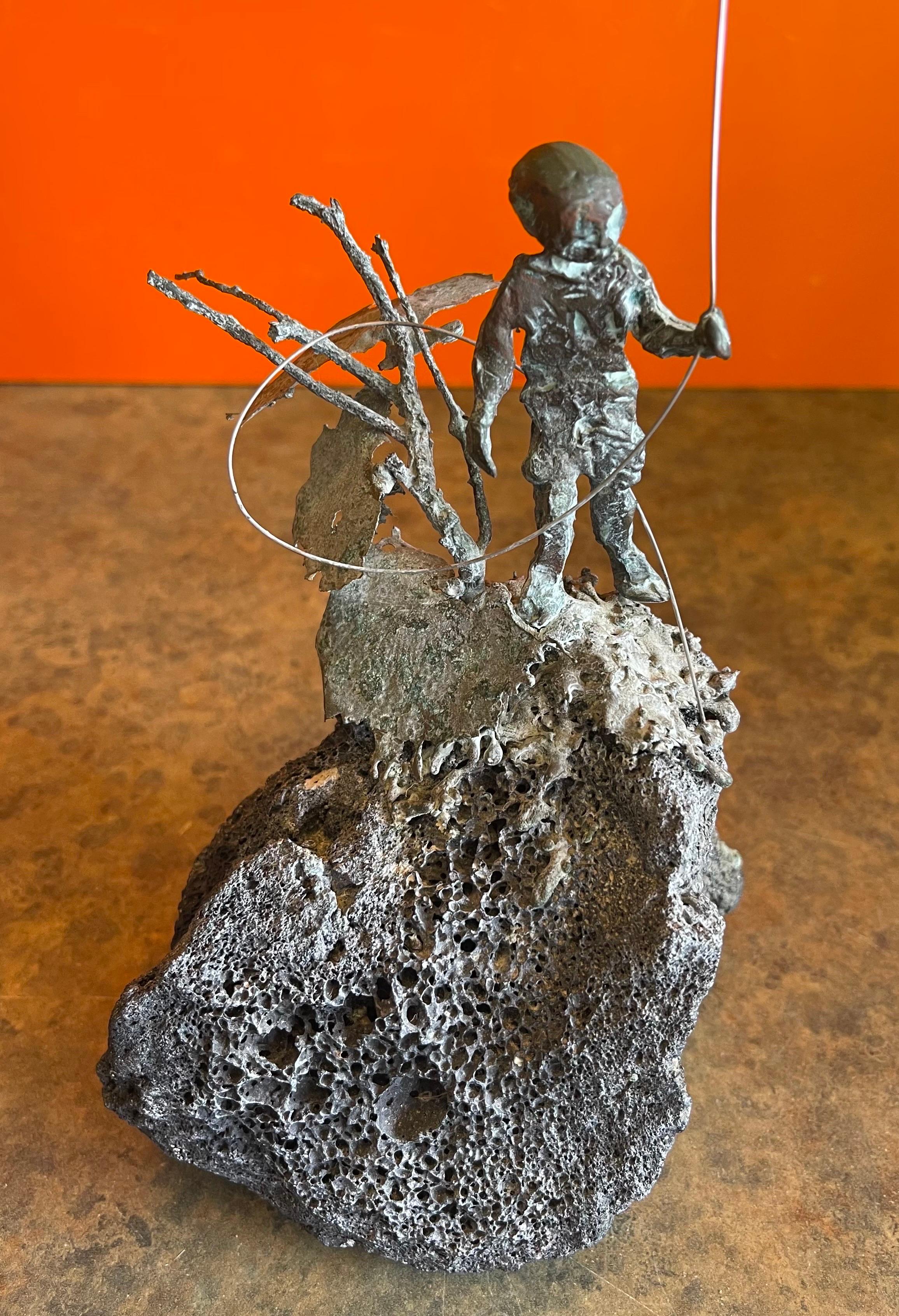 Child Flying Kite Bronze on Volcanic Rock Sculpture by Malcolm Moran 4
