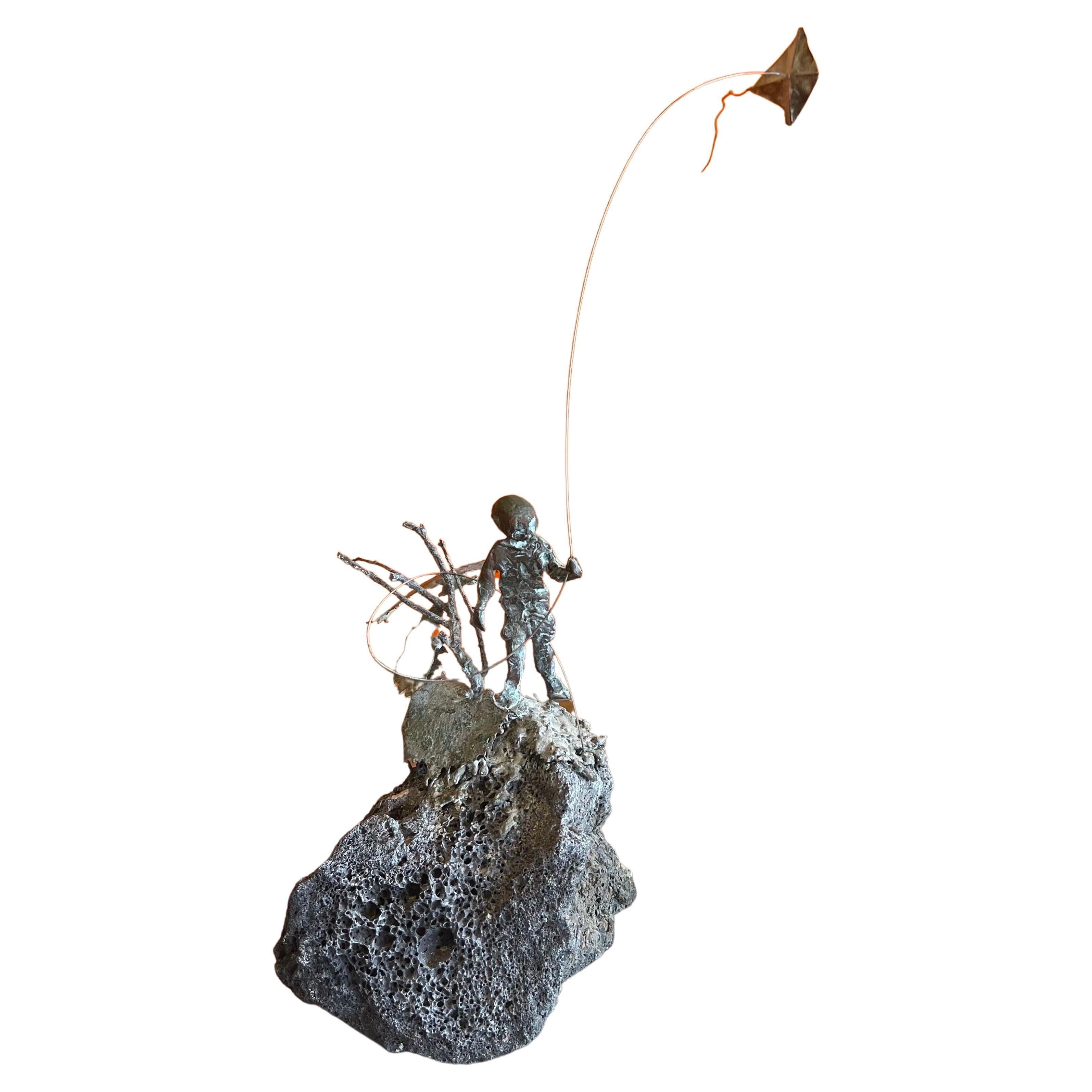 Child Flying Kite Bronze on Volcanic Rock Sculpture by Malcolm Moran 7