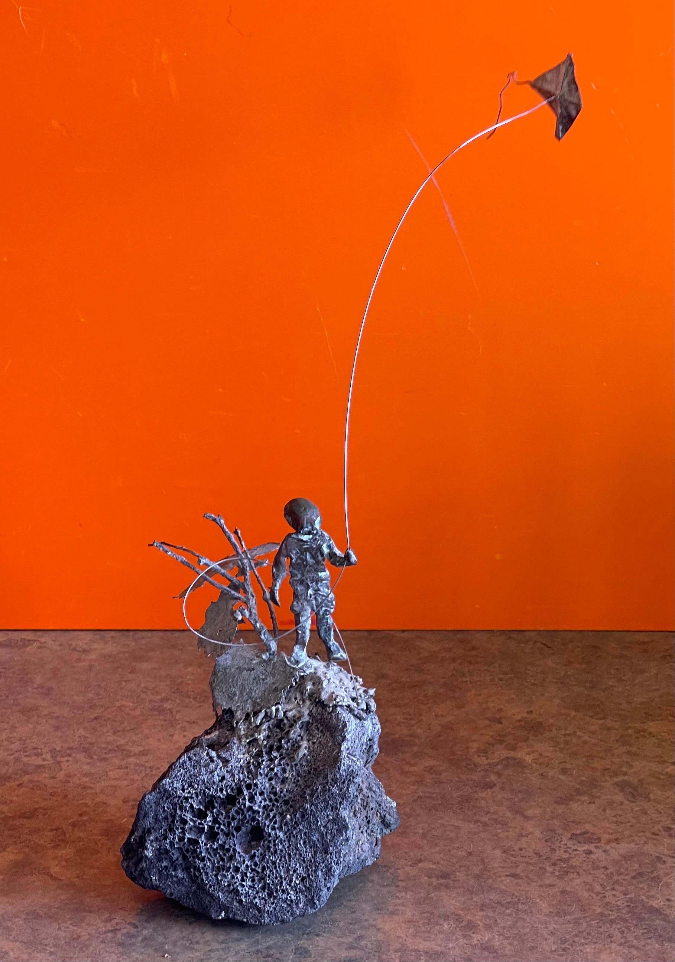 Mid-Century Modern Child Flying Kite Bronze on Volcanic Rock Sculpture by Malcolm Moran