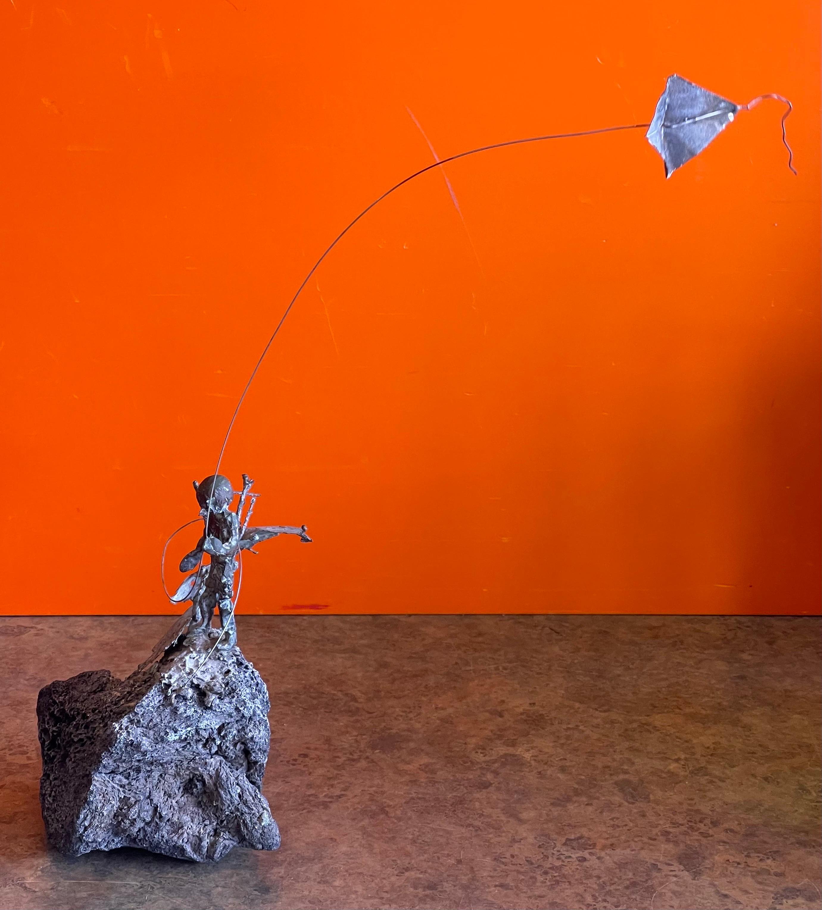 American Child Flying Kite Bronze on Volcanic Rock Sculpture by Malcolm Moran