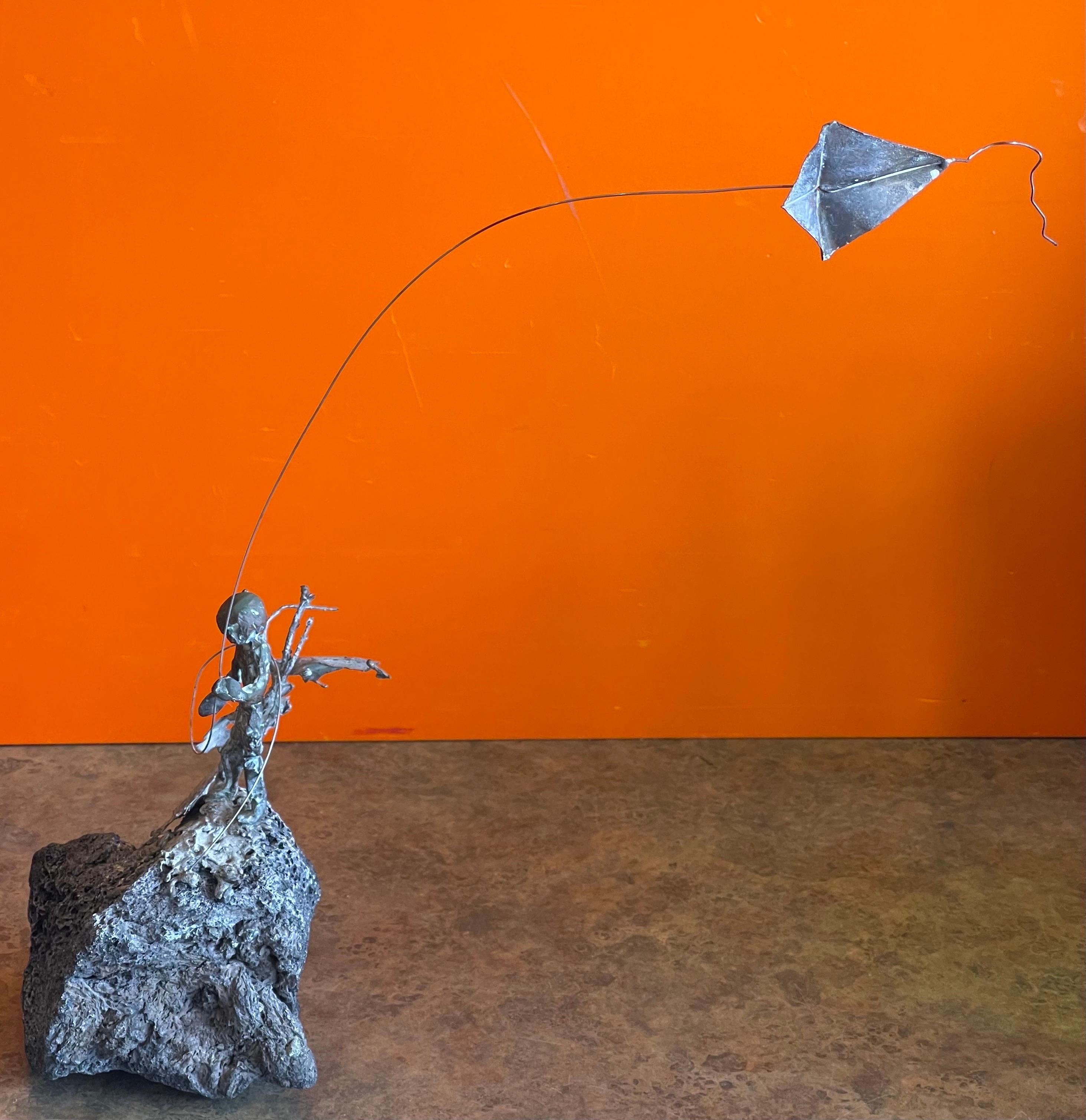 Child Flying Kite Bronze on Volcanic Rock Sculpture by Malcolm Moran In Good Condition For Sale In San Diego, CA