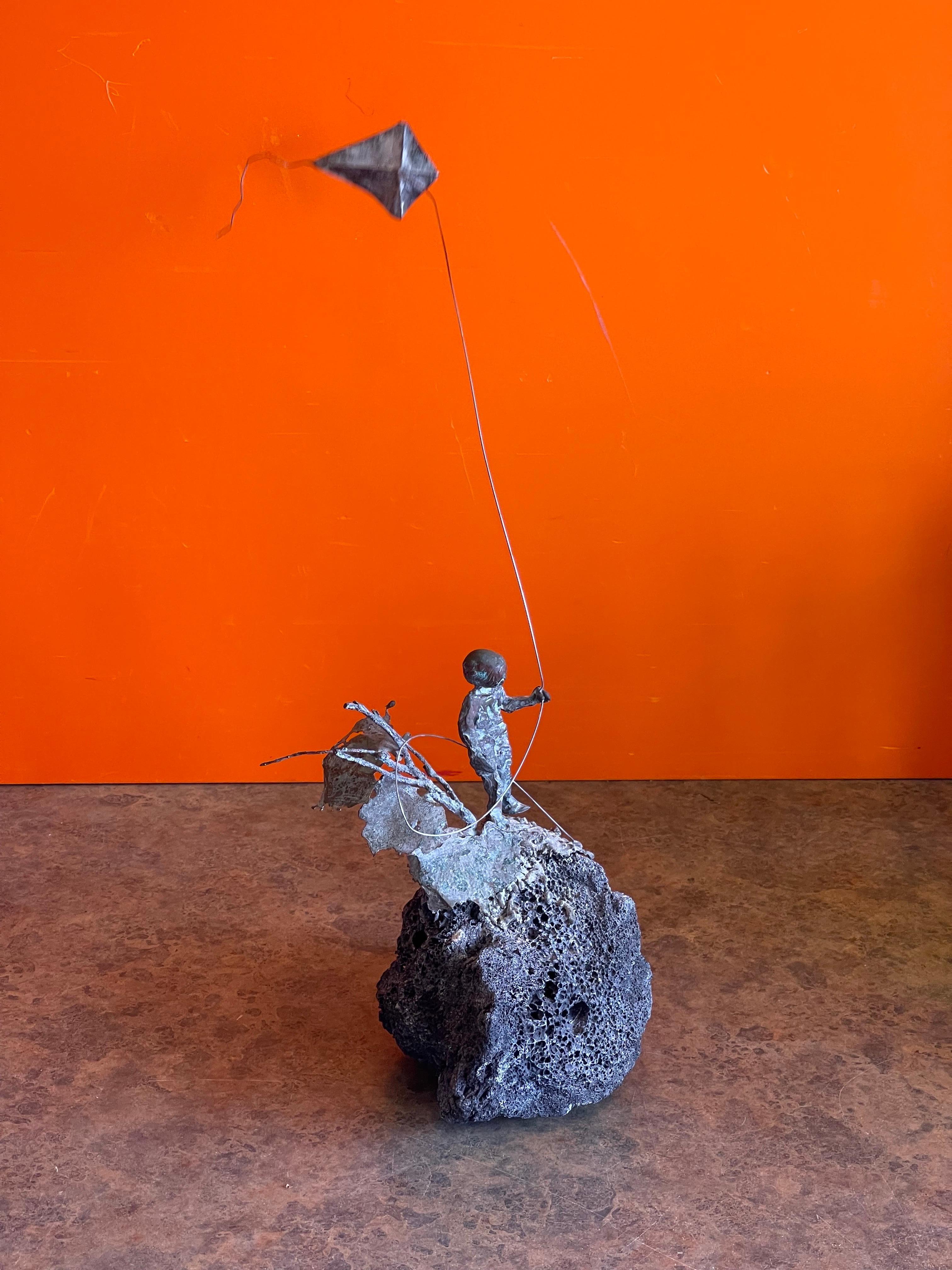 Child Flying Kite Bronze on Volcanic Rock Sculpture by Malcolm Moran 1