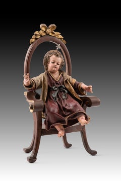 Child Jesus enthroned. Wood, terracotta, fabric. Spanish school, 18th c etc.