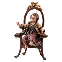 Child Jesus enthroned. Wood, terracotta, fabric. Spanish school, 18th c etc.