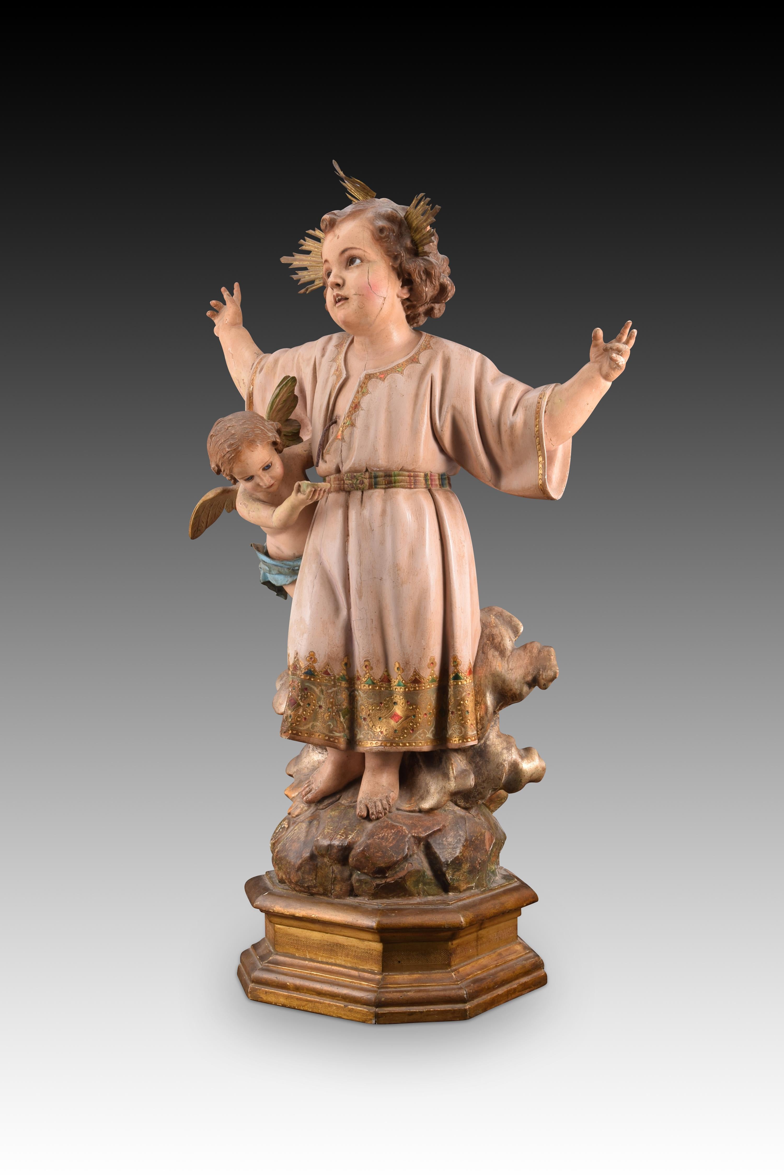 Baby Jesus of the Blood. Carved and polychrome wood, metal, etc. Spanish school, 19th century. 
Has damage. 
Carving of Baby Jesus with a polygonal base on which he is presented dressed in an decorated tunic, standing on some rocks and with clouds,