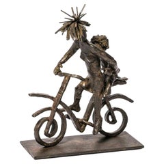 Enfant sur bicyclette, sculpture en bronze