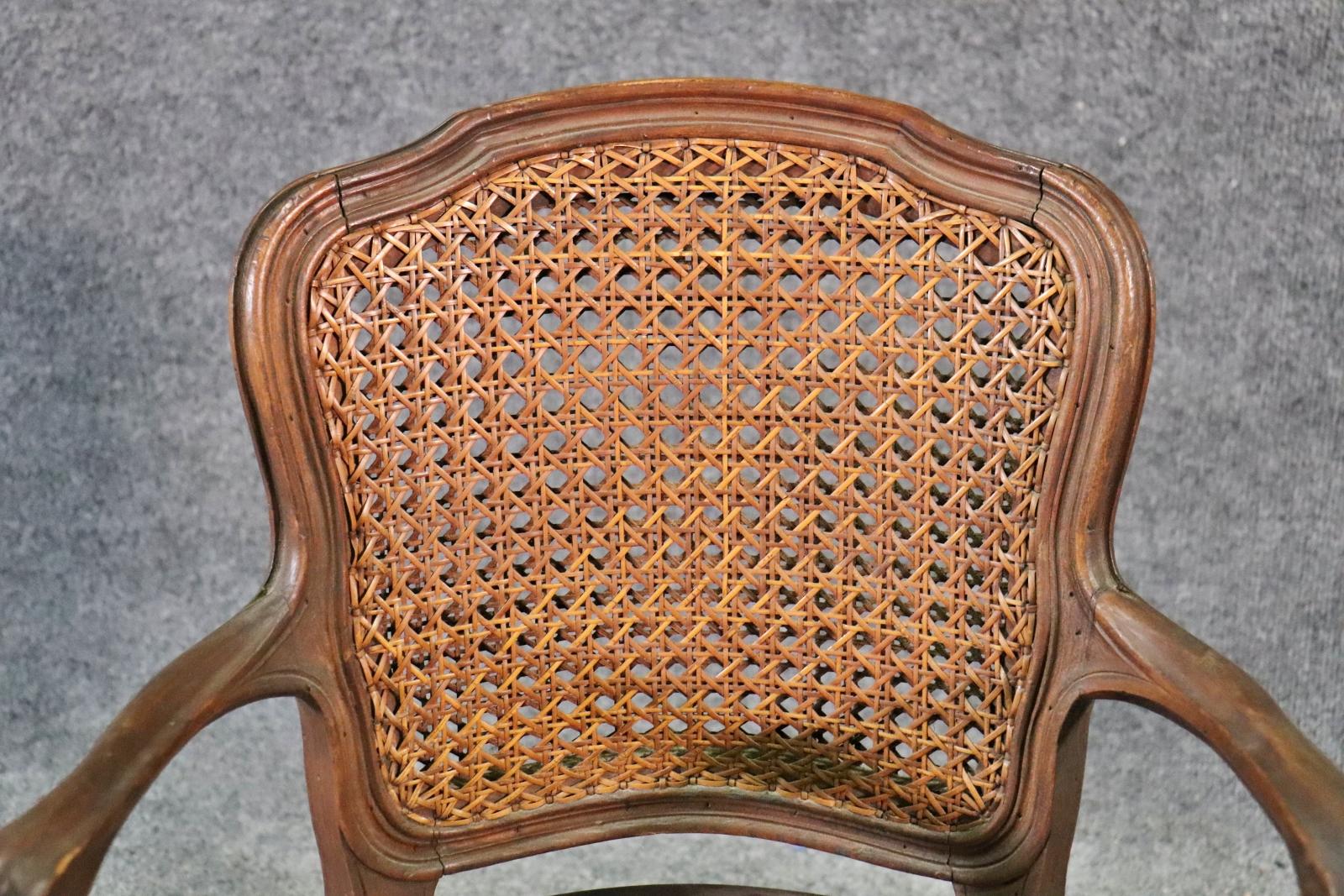 Child Size French Made 1920s era Hand Woven Louis XV Style Cane Arm Chair In Good Condition For Sale In Swedesboro, NJ