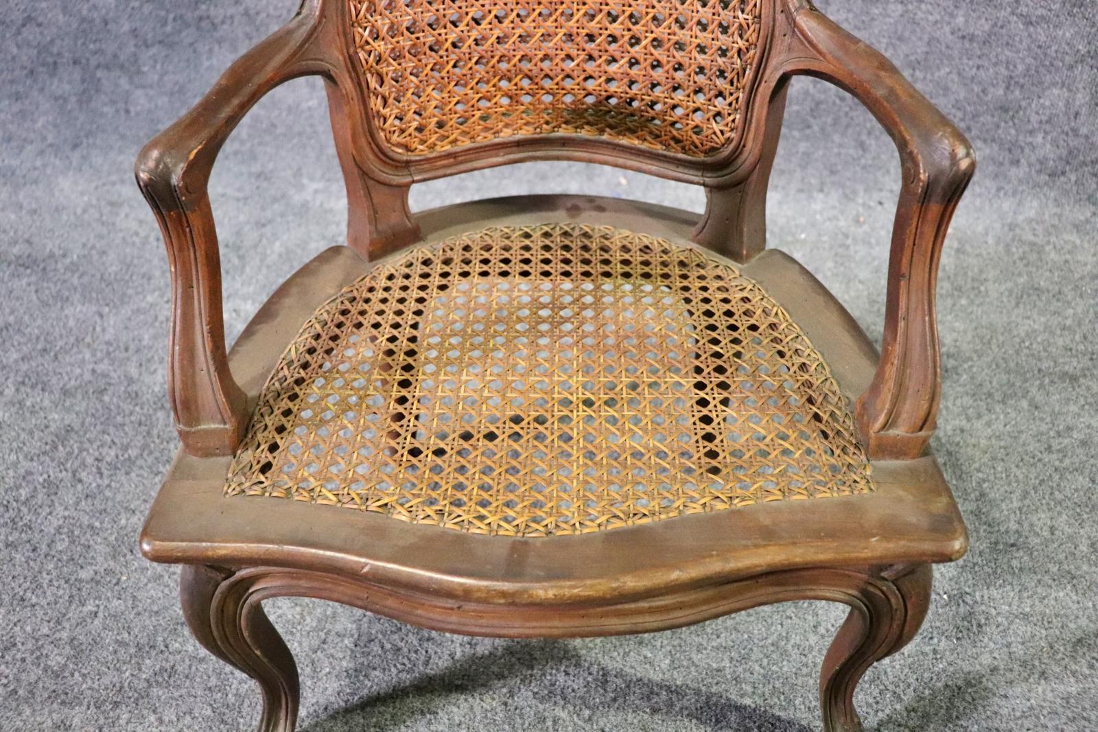 Early 20th Century Child Size French Made 1920s era Hand Woven Louis XV Style Cane Arm Chair For Sale