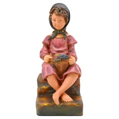 Sculpture d'enfant avec un panier de fruits, 1900