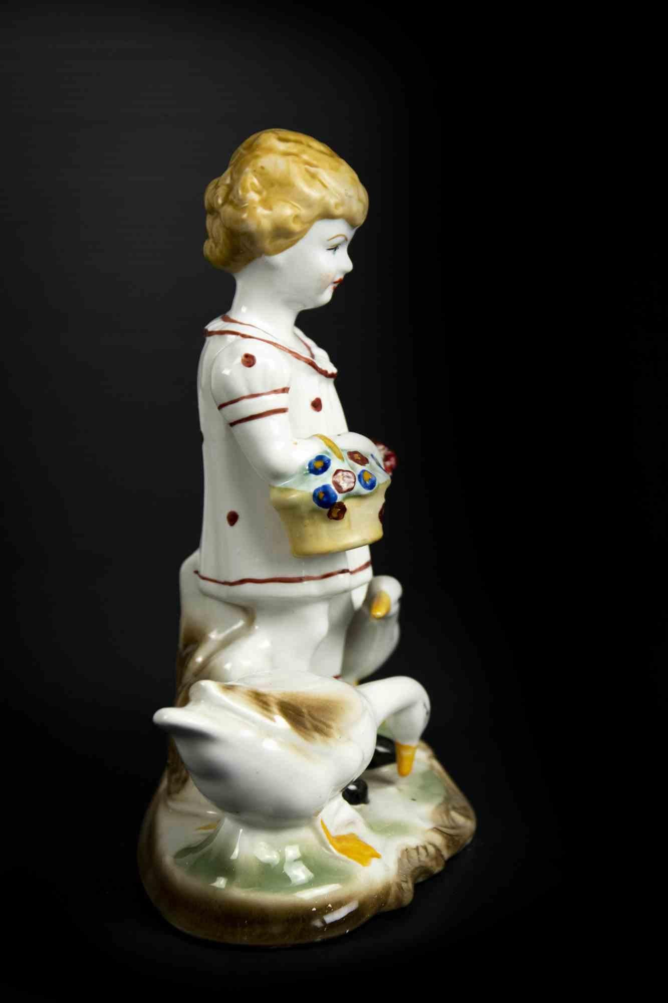 Child with geese centerpiece is a original decorative object realized in the half of 20th century.

Made in Italy. 

The object is realized with colored porcelain. 

On the base the original label with 