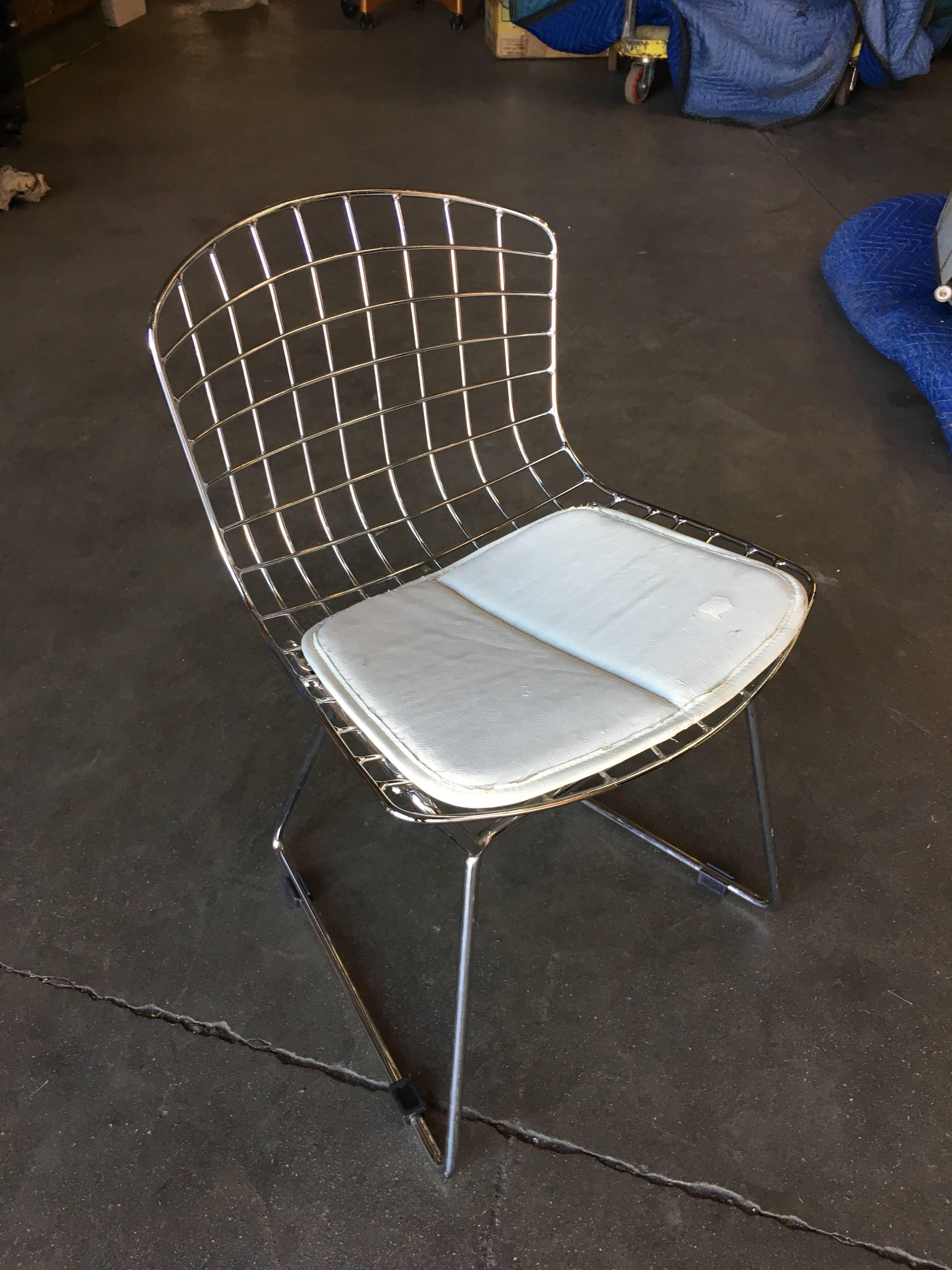 Pair of chrome children's Bertoia side chair with white seat cushion by Knoll.
