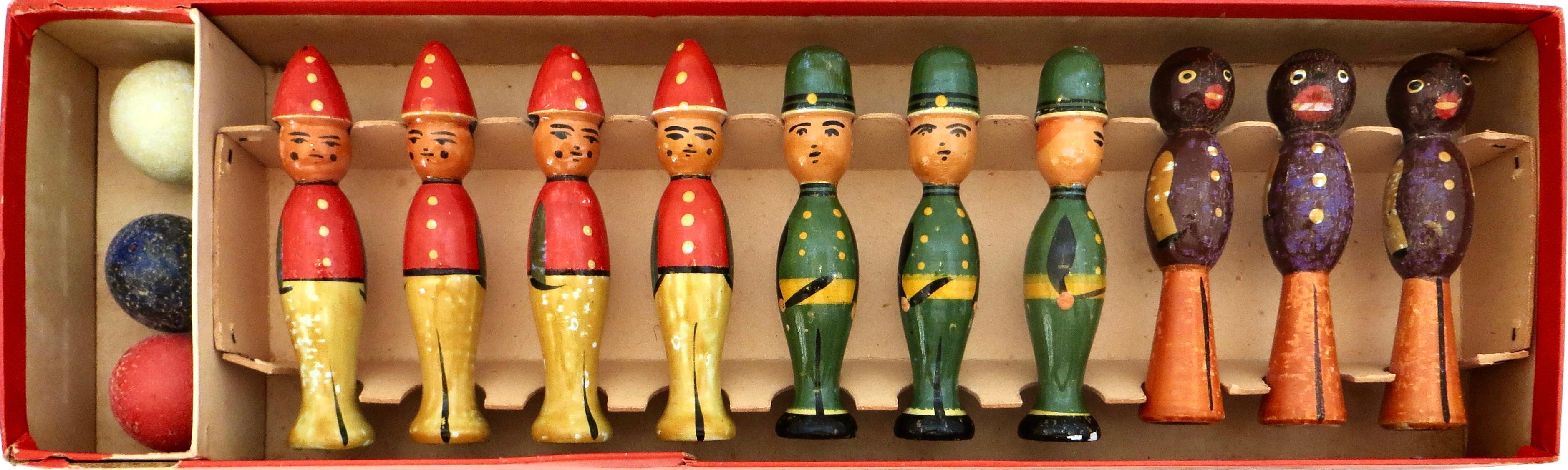 This rare and unique game is in excellent all original condition with it's original, highly lithographed colorful box, This seemingly little used pre-war game is completely intact and consists of ten wooden pins, all hand painted in three different