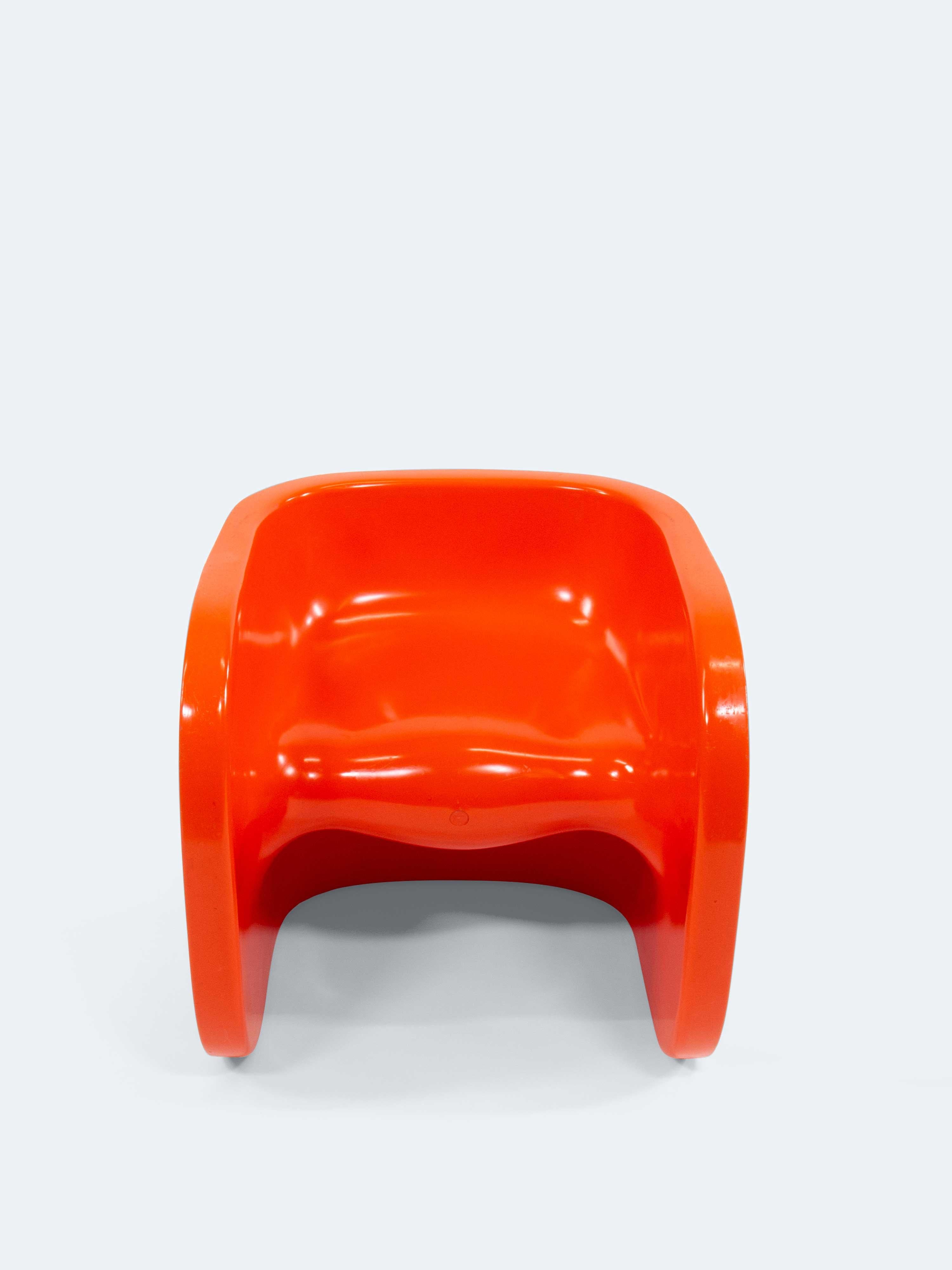 This playful children's armchair by Peter Hiort-Lorenzen is a perfect embodiment of the vibrant and innovative spirit of the 1970s. Crafted from injection-molded ABS plastic and dyed a bold orange throughout, the chair adds an energetic accent to