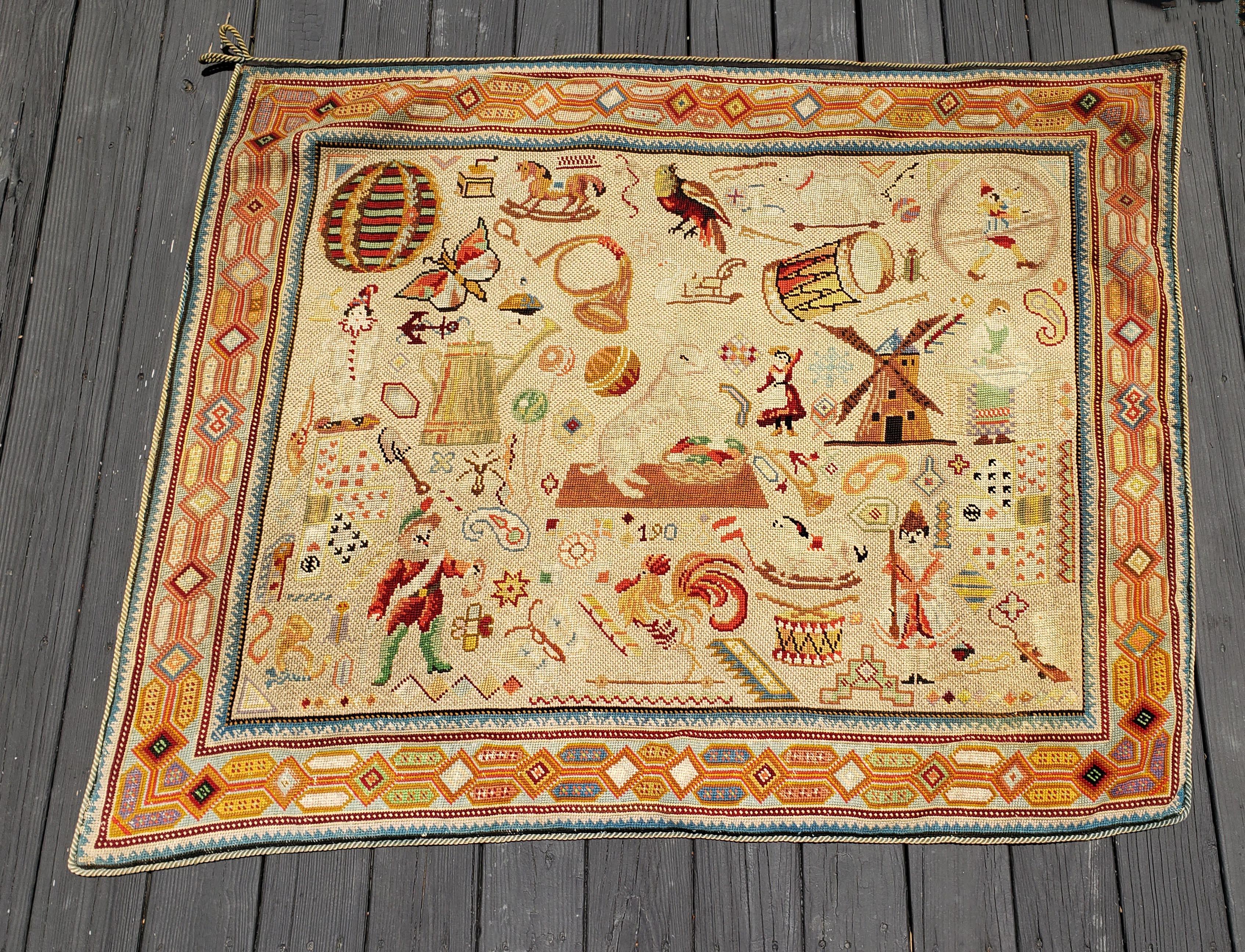 Children's Edwardian needlepoint wall hanging
Early 20th century

The rectangular needlepoint is decorated with different children's playthings.

Dimensions: 50 inches x 62 inches.
   