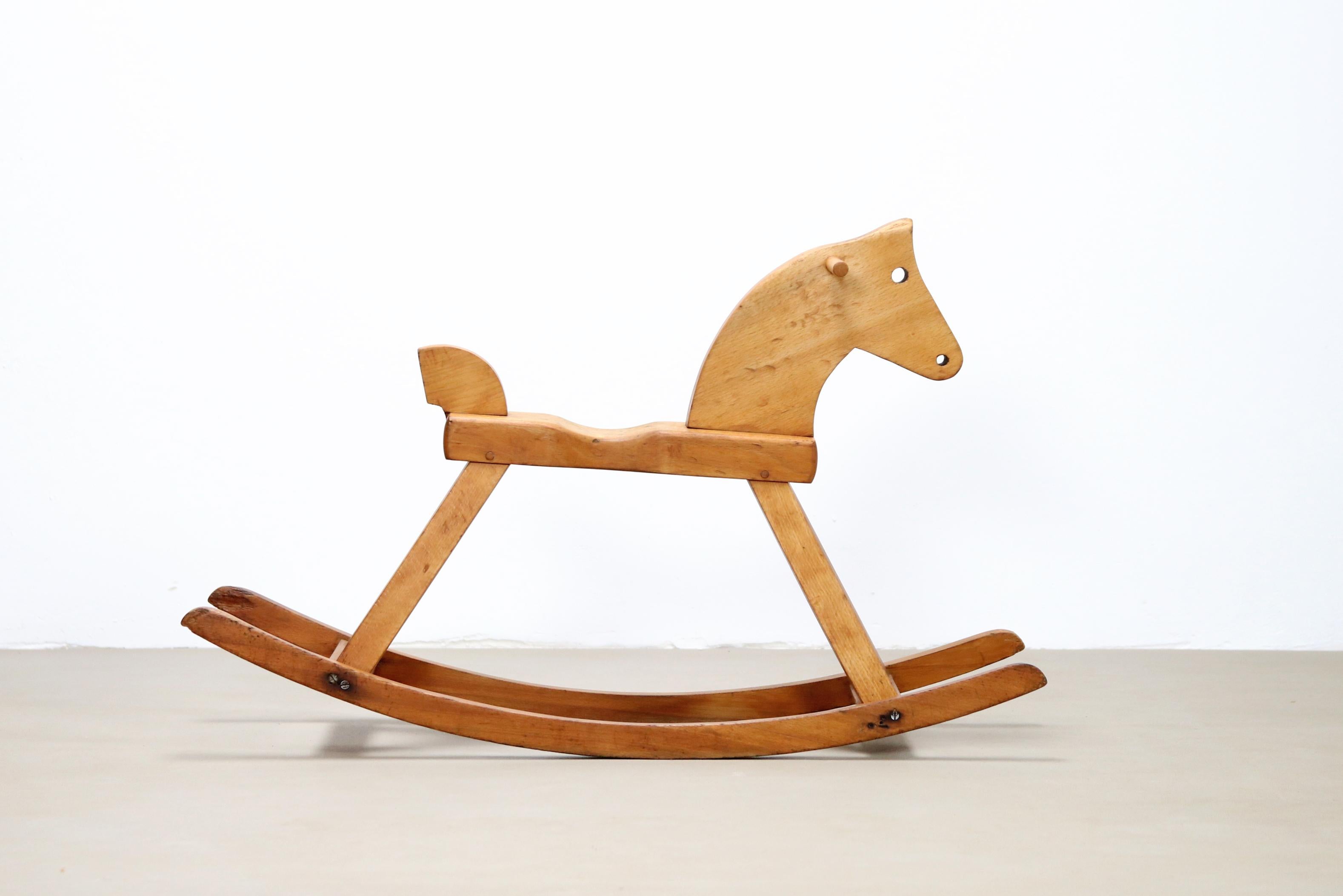 Officially children's toys, but an art object in itself. 
This very beautiful Kay Bojesen rocking horse is made of solid beechwood and marked by the manufacturer on its belly.
The horse was designed from 1936 and is design in a way that exactly