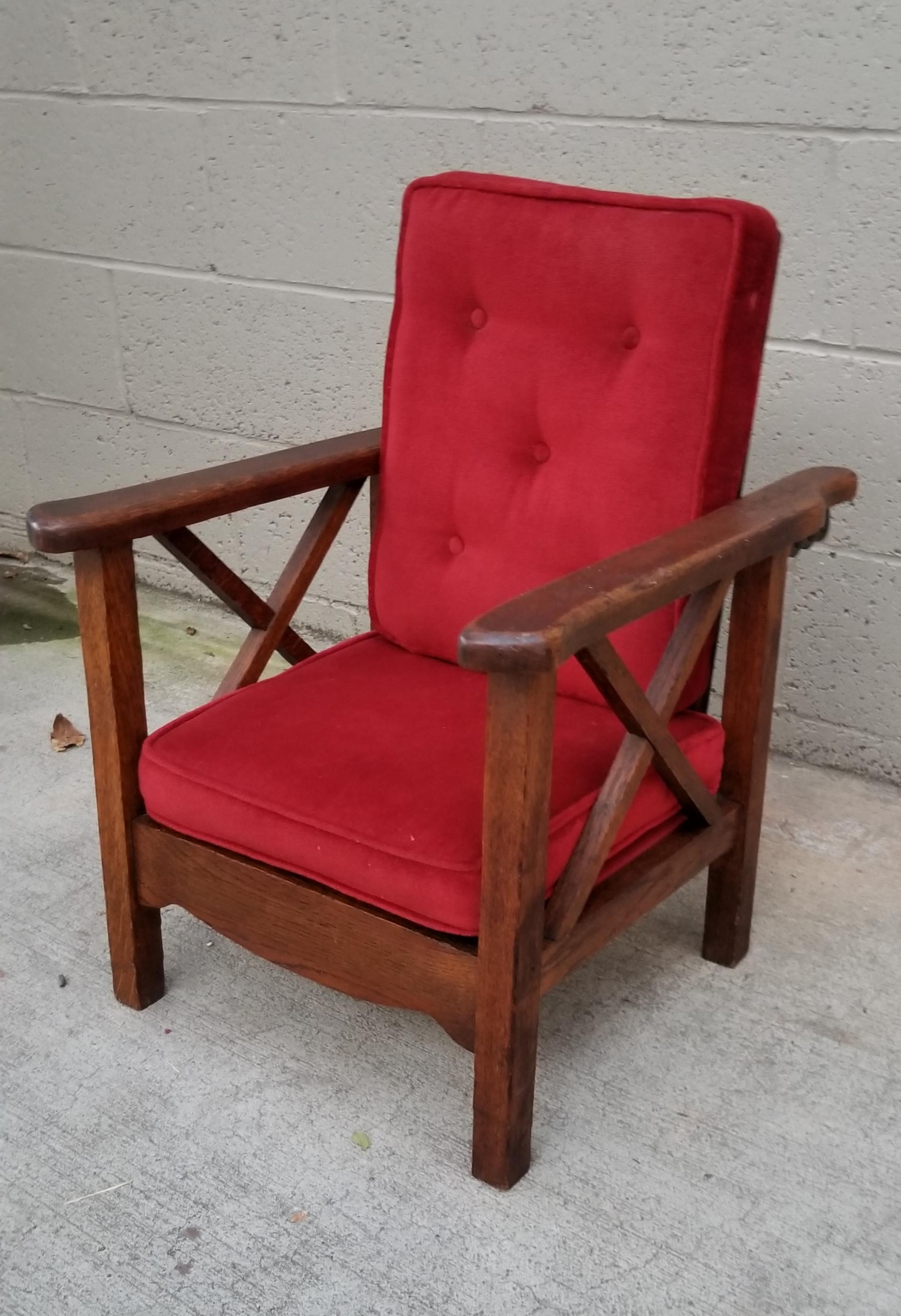 A charming period Arts & Crafts / Mission Oak child's reclining Morris chair with original finish to frame. Older velvet re-upholstery in very good condition. 

Morris chair
A Morris chair is an early type of reclining chair. The design was