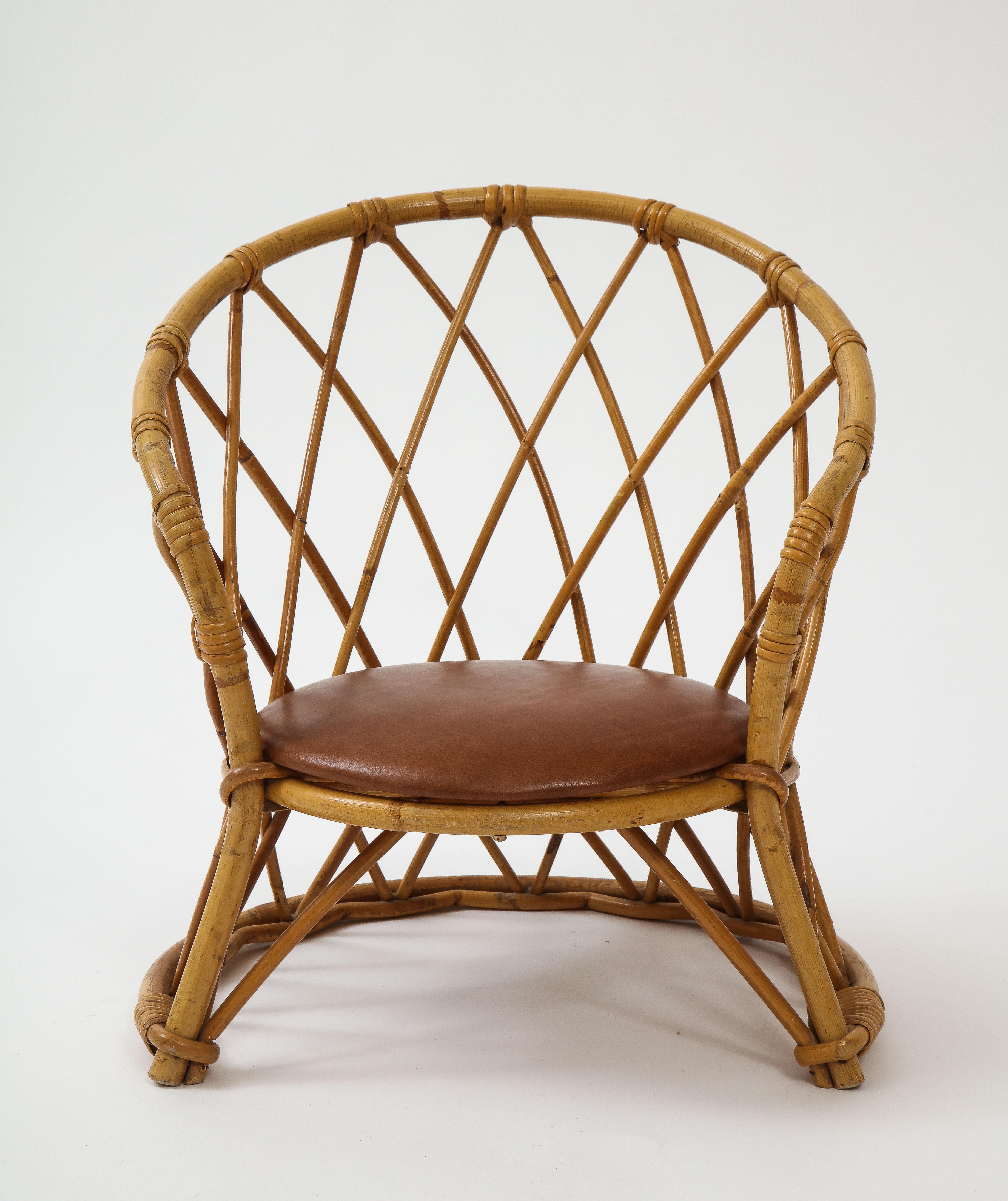 Childrens rattan chair with brown leather seat, 1950s, France.

Super chic children's chair, to be placed anywhere the kids hang out so they can have their own space. Lovely condition, new leather seat.