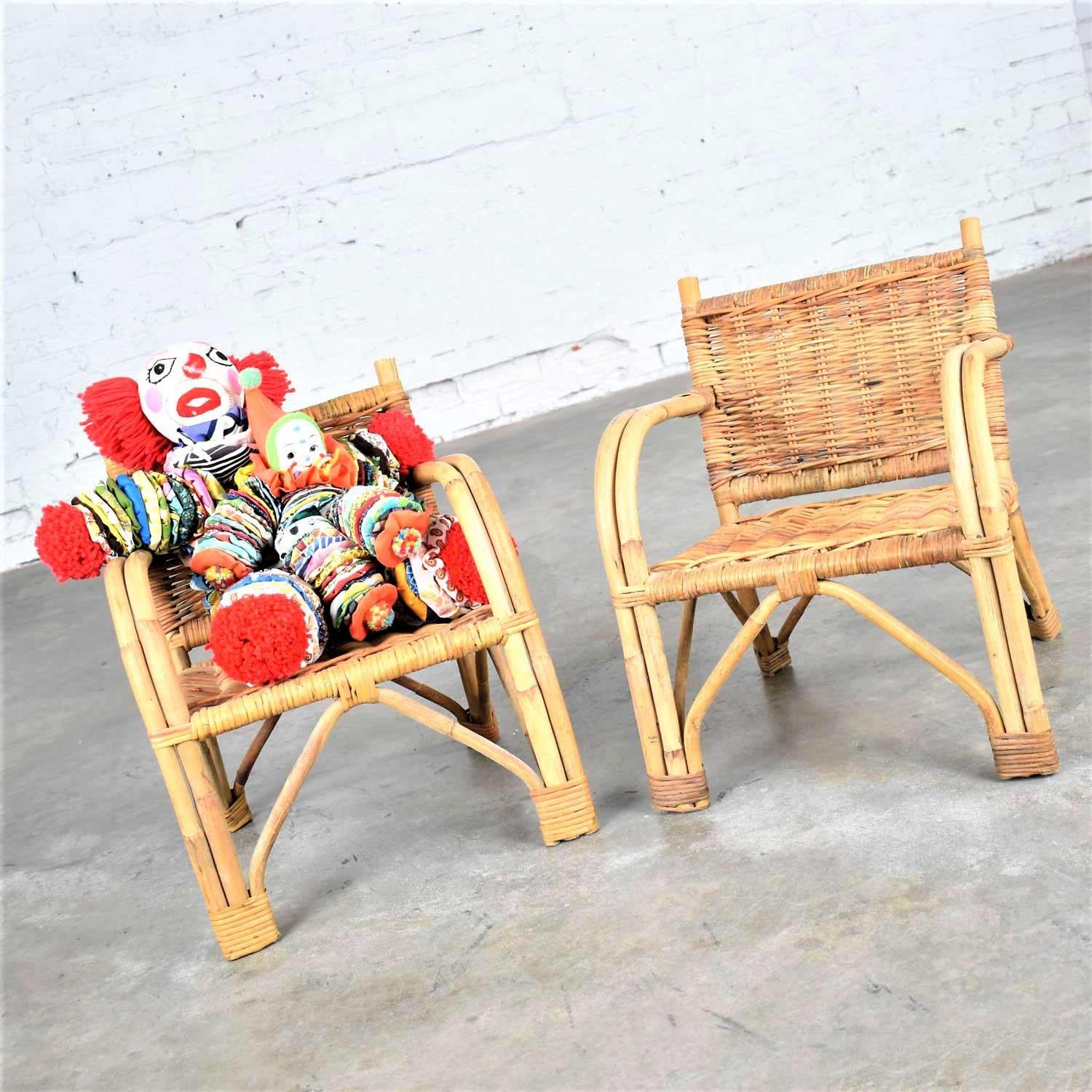 Awesome pair of children’s rattan and wicker chairs with bent arms. They are in wonderful original vintage condition. Please see photos, circa 1930-1960.

These chairs are so fun we had a hard time keeping the clowns off them! They would be a
