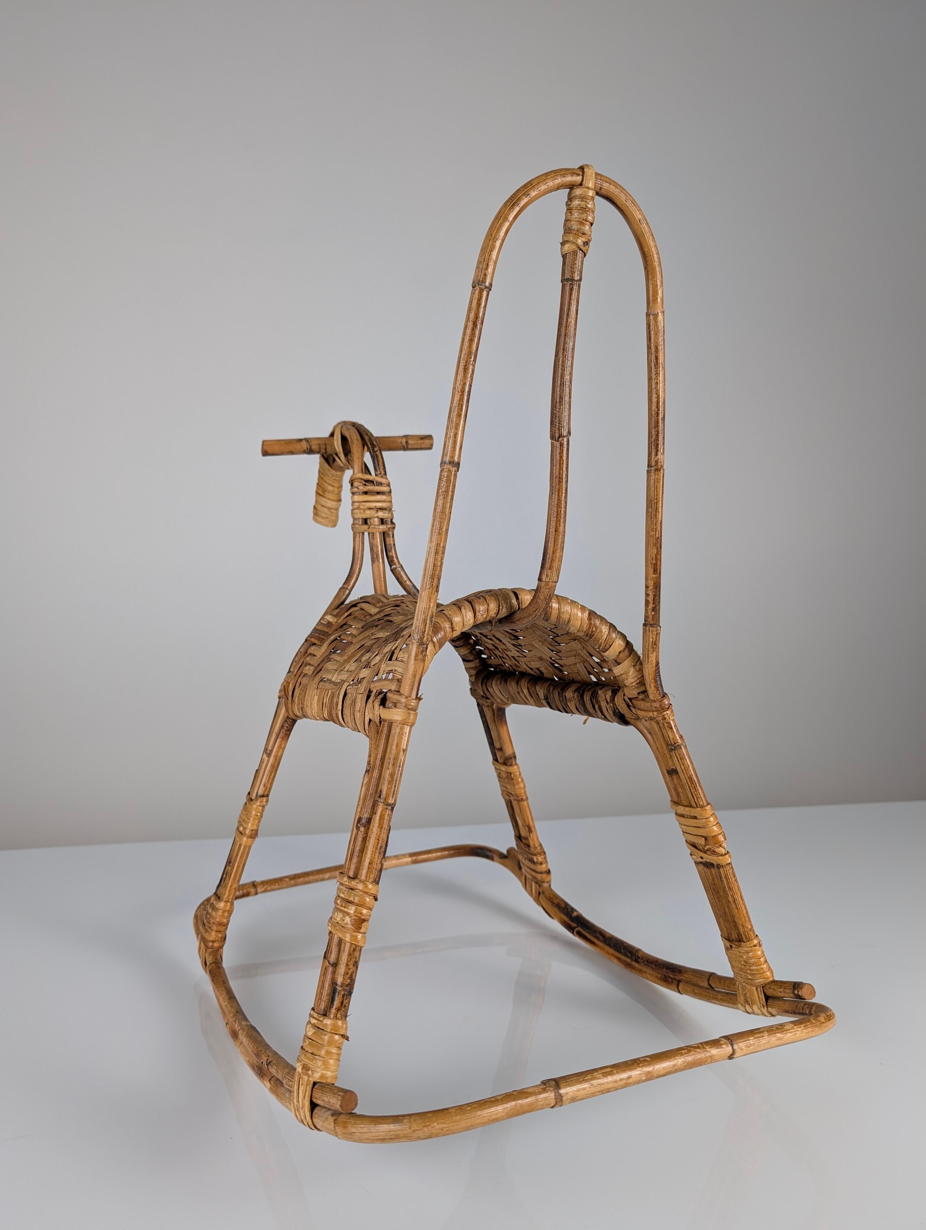 Mid-Century Rattan and Bamboo Rocking Horse. A beautiful and functional decorative addition to any playroom or child's room that will ensure the little ones have fun.