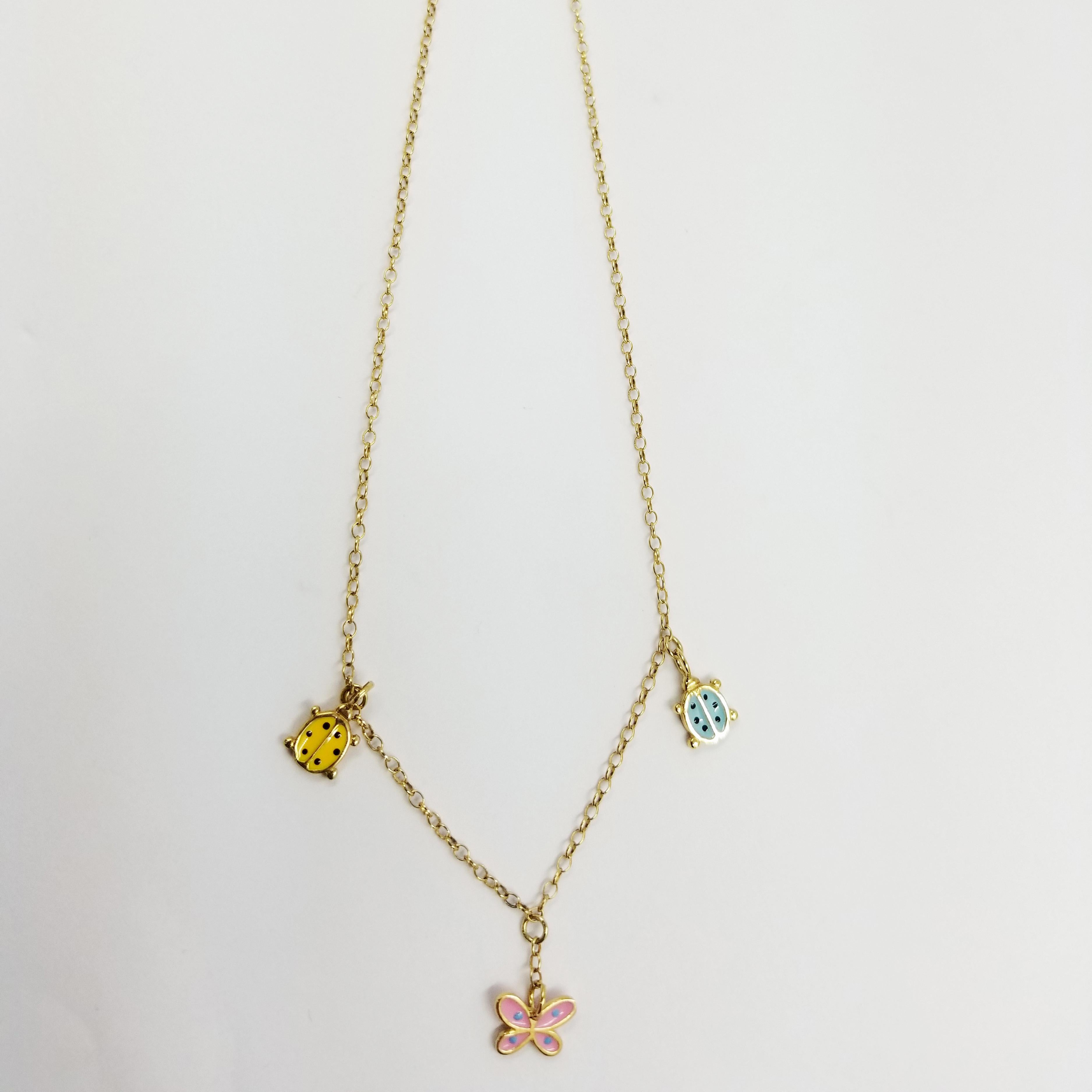 18 Karat Yellow Gold Children's Necklace Featuring Three Enamel Pendants. One Pink Butterfly, One Yellow Lady Bug, and One Blue Lady Bug Drop From The Center. Length is 14 Inches with Lobster Clasp (Kid or Baby Length).