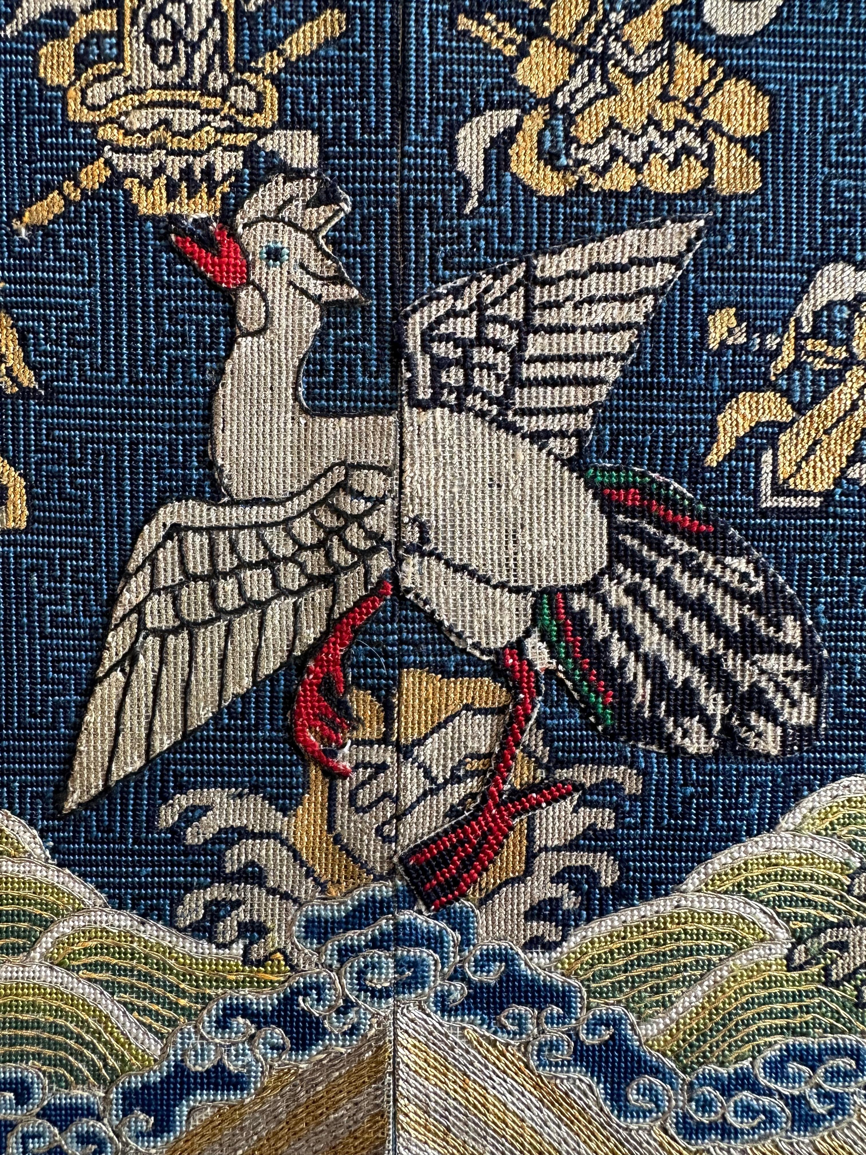 Qing Dynasty brocade civil rank badge with silver pheasant, intended for the front of a child's robe.

This badge, made for the child of a civil official of the fifth rank, most likely his eldest son, features a silver pheasant, which can be