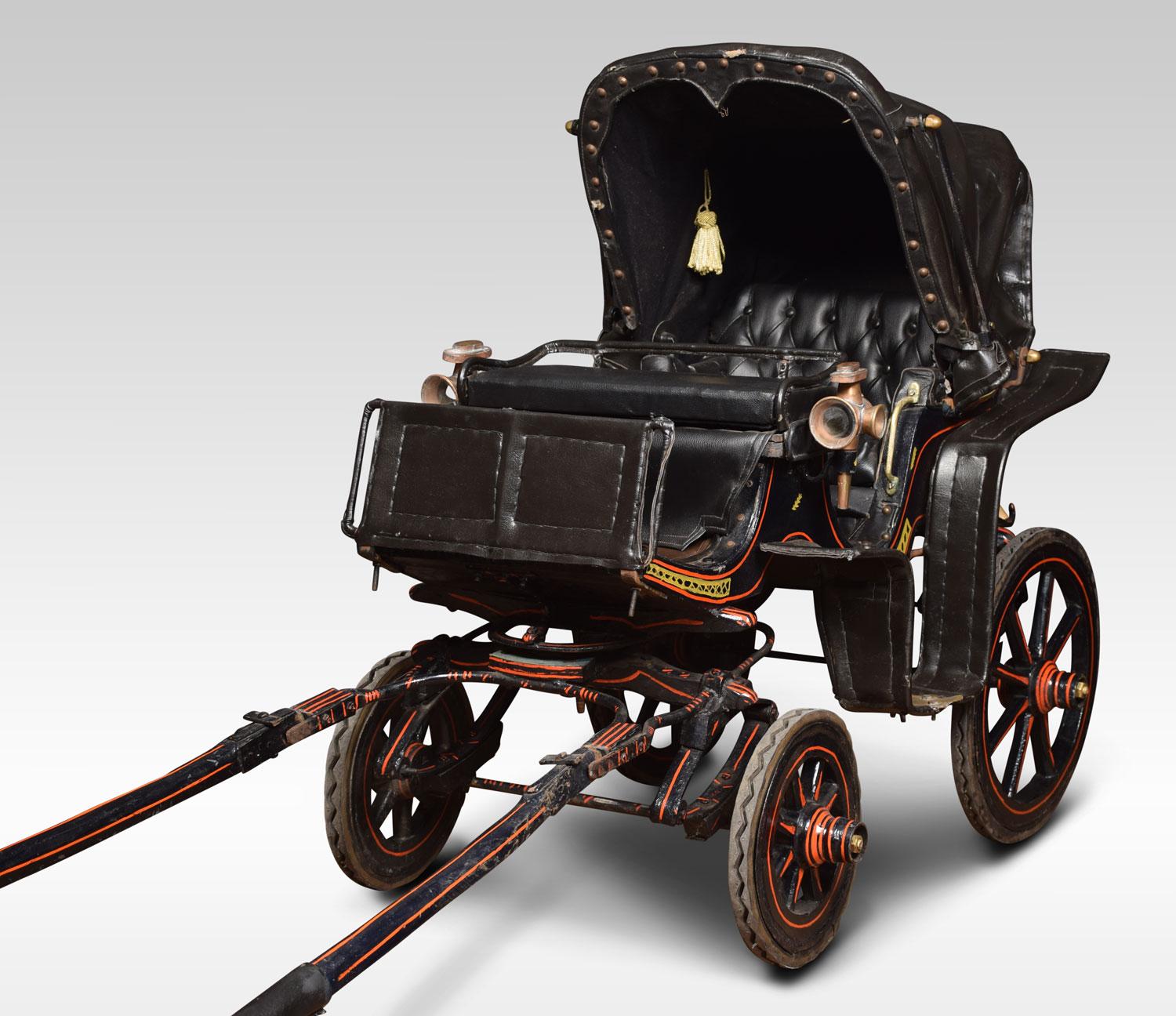 Late Victorian Childs carriage. The wheels having rubber rims and spoked wheels. The carriage painted red and black with upholstered seat and working leather canopy. Having original brass side lamps.
Dimensions
Height 38.5 inches
Width 27.5