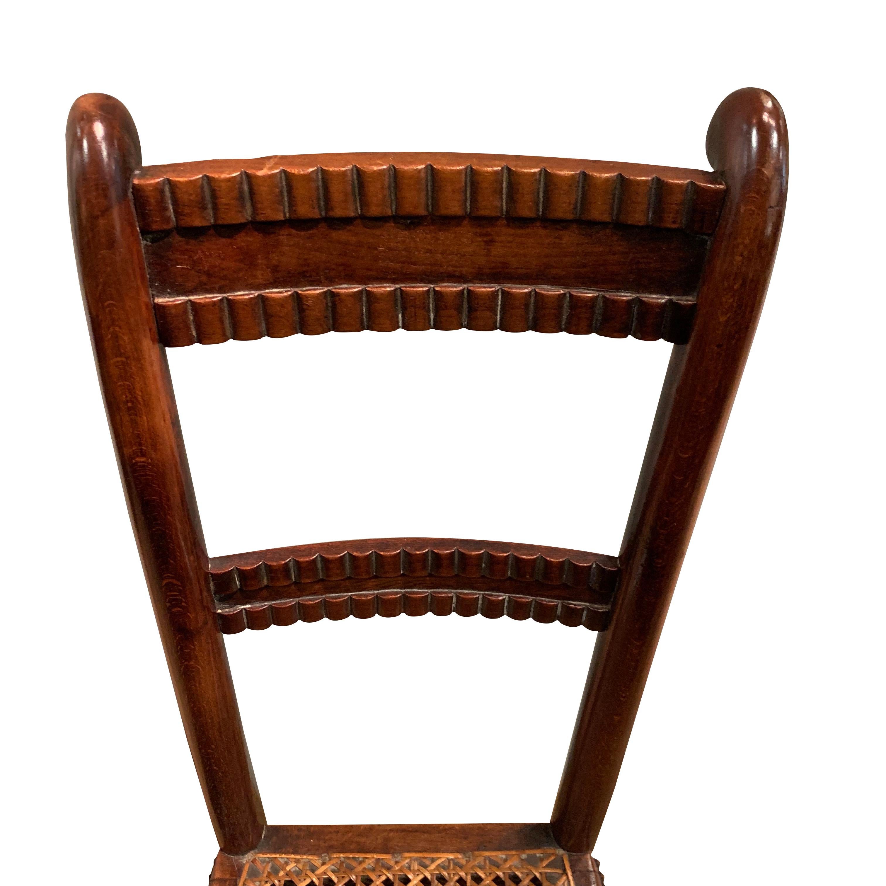 19th century English childs deportment chair
Used to teach young children good posture
Made of beechwood

 