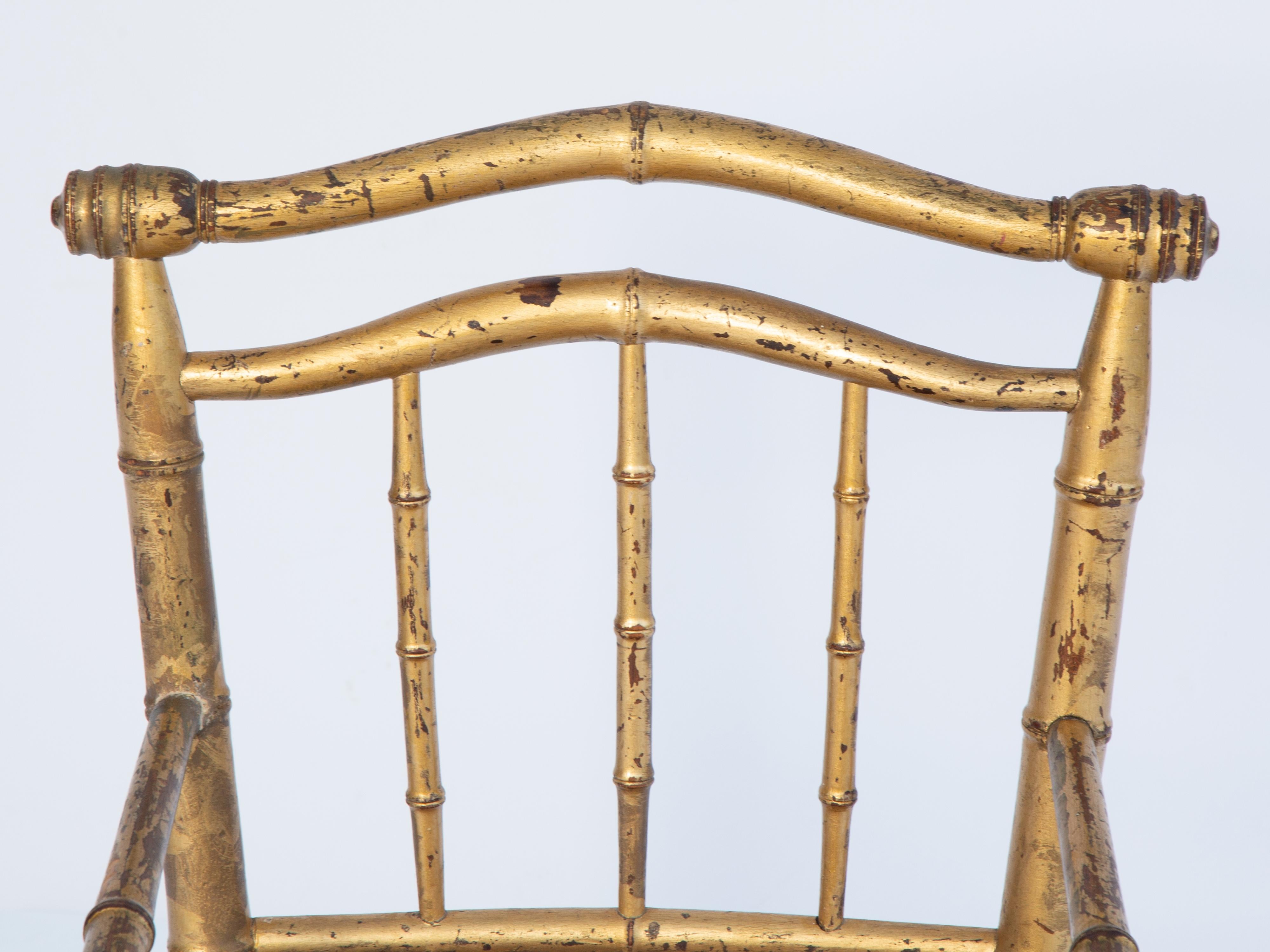 Giltwood faux bamboo child's armchair having a double arched crestrail over three pickets, its upholstered seat in Scalamandre leopard print velvet, raised on round, tapering legs, joined by box-stretcher. 

Arm Height: 17 in

Stock ID: D3890