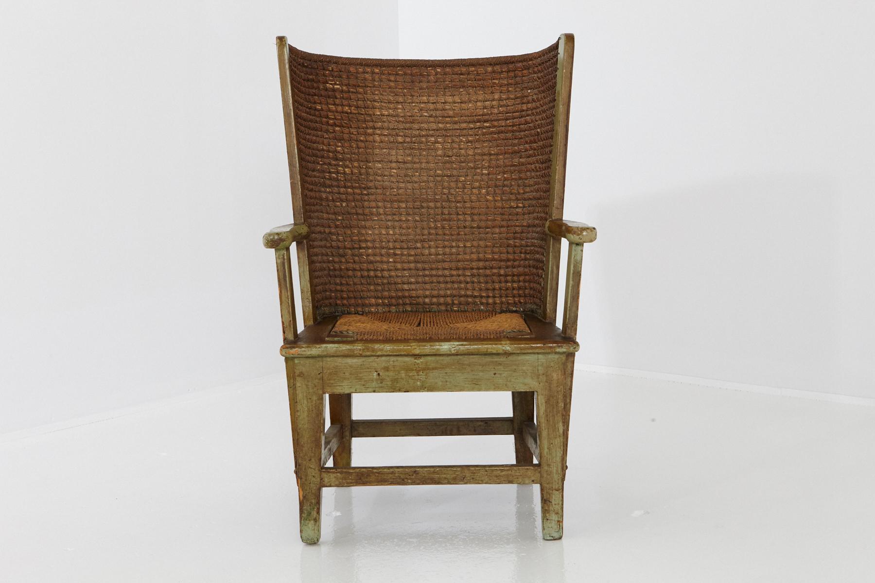 Late 19th-century child's armchair or fauteuil from the Scottish Orkney Islands, also referred to as Orkney Chair.
The Orkney chair features an oak frame supporting a demicircle back in the style of wingback chairs, handwoven with straw. 
The