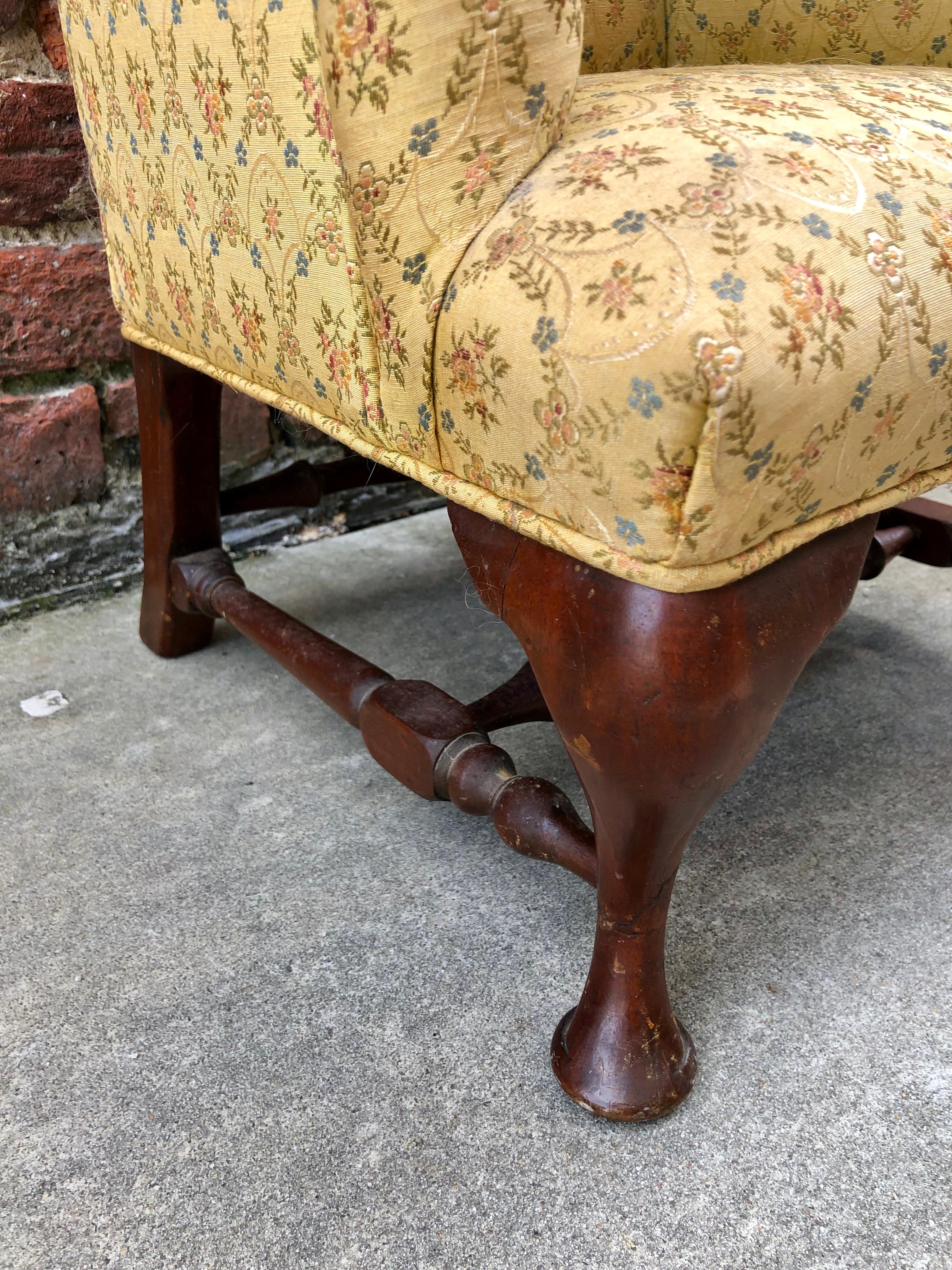 Child’s Queen Anne style wingback chair. Turned stretchers and nicely carved pad feet.