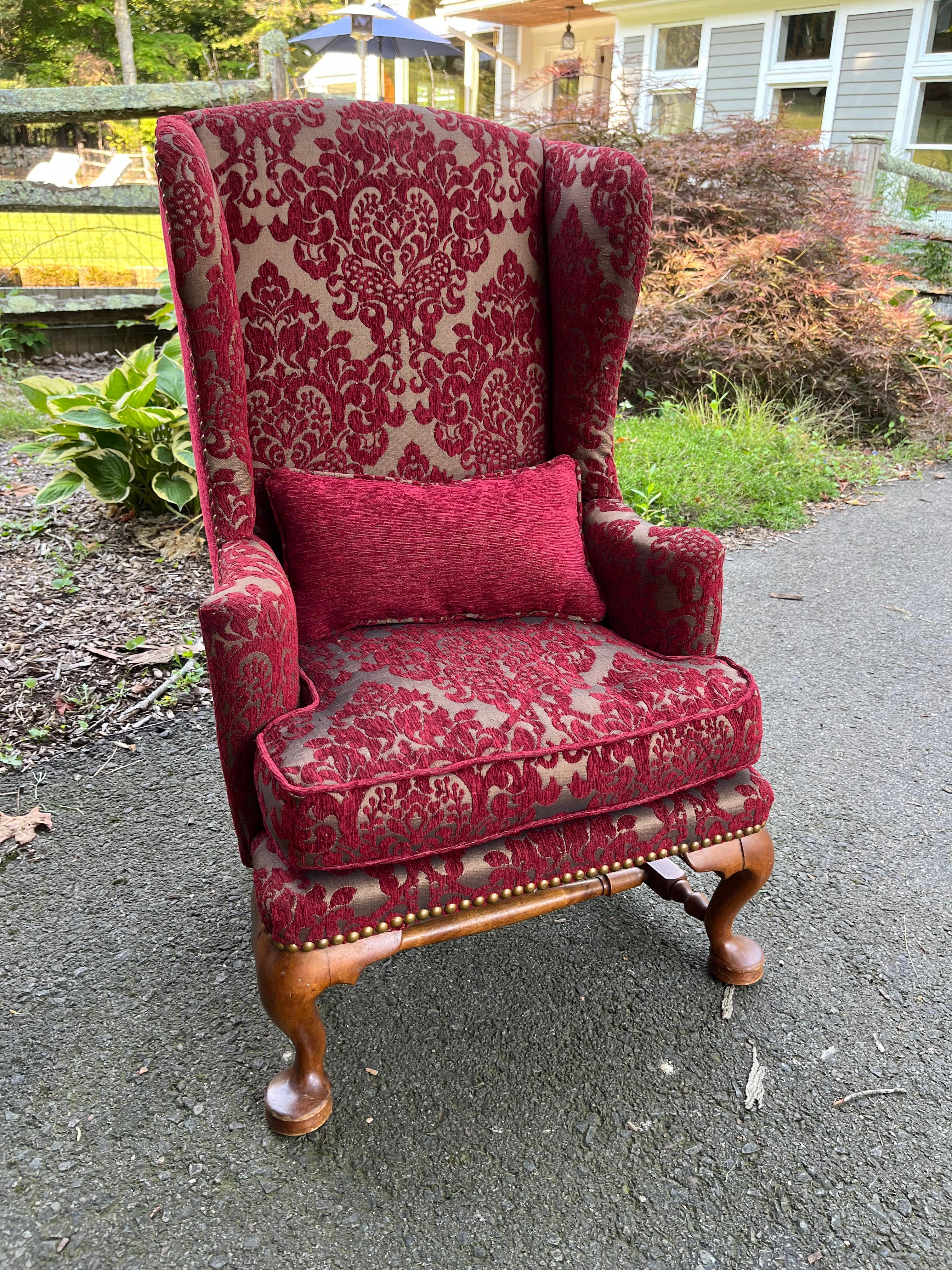 An adorable child’s size wing-back chair, nicely upholstered in burgundy wood brocade fabric with brass nailhead details and matching pillow. The perfect Christmas gift for a little prince or princess.