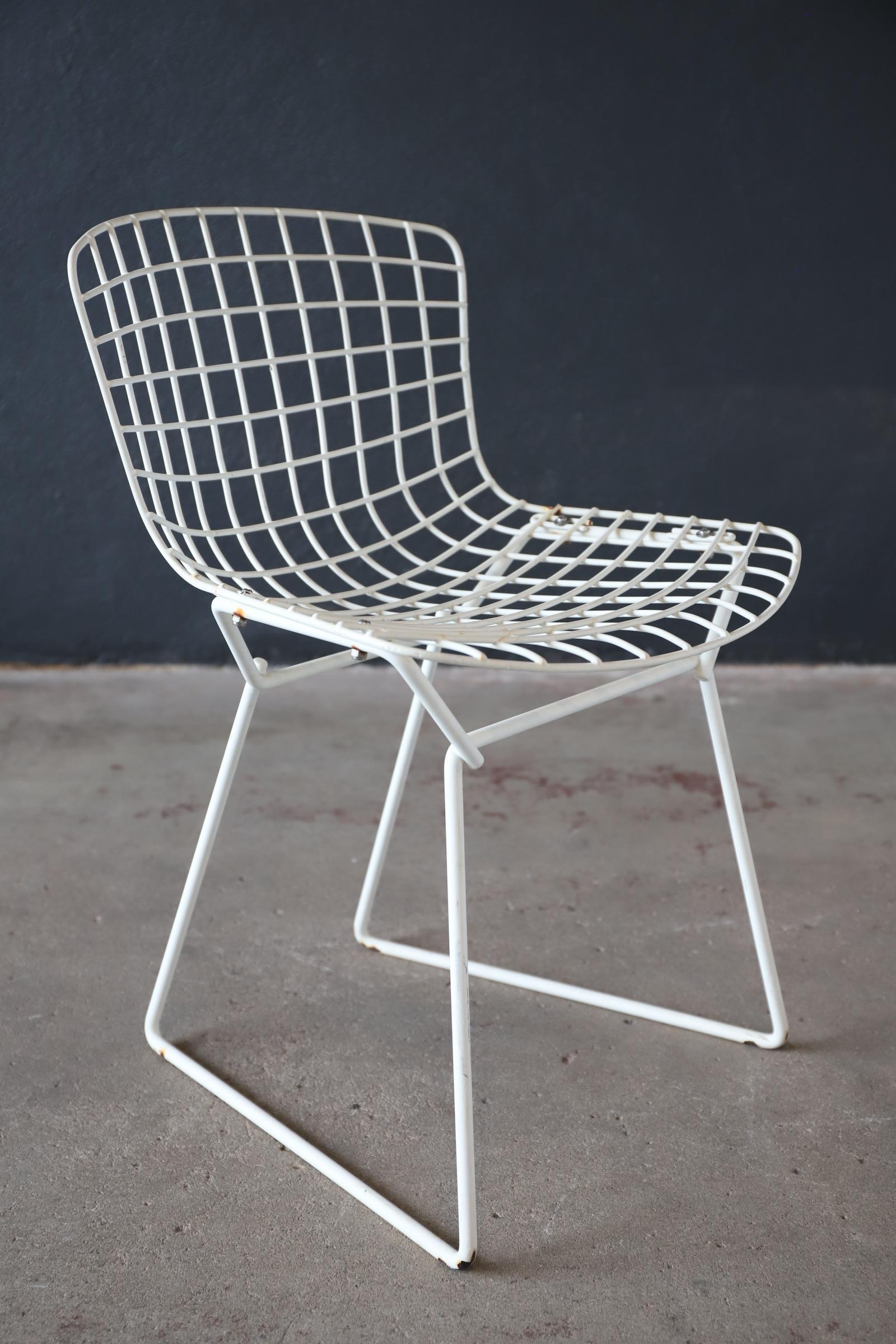 A staple design from famous designer Harry Bertoia for Knoll. A child’s Size wire side chair. Great for indoor or outdoor use. Your kid will definitely have the coolest chair on the block. Photographed with Eames chair for scale.