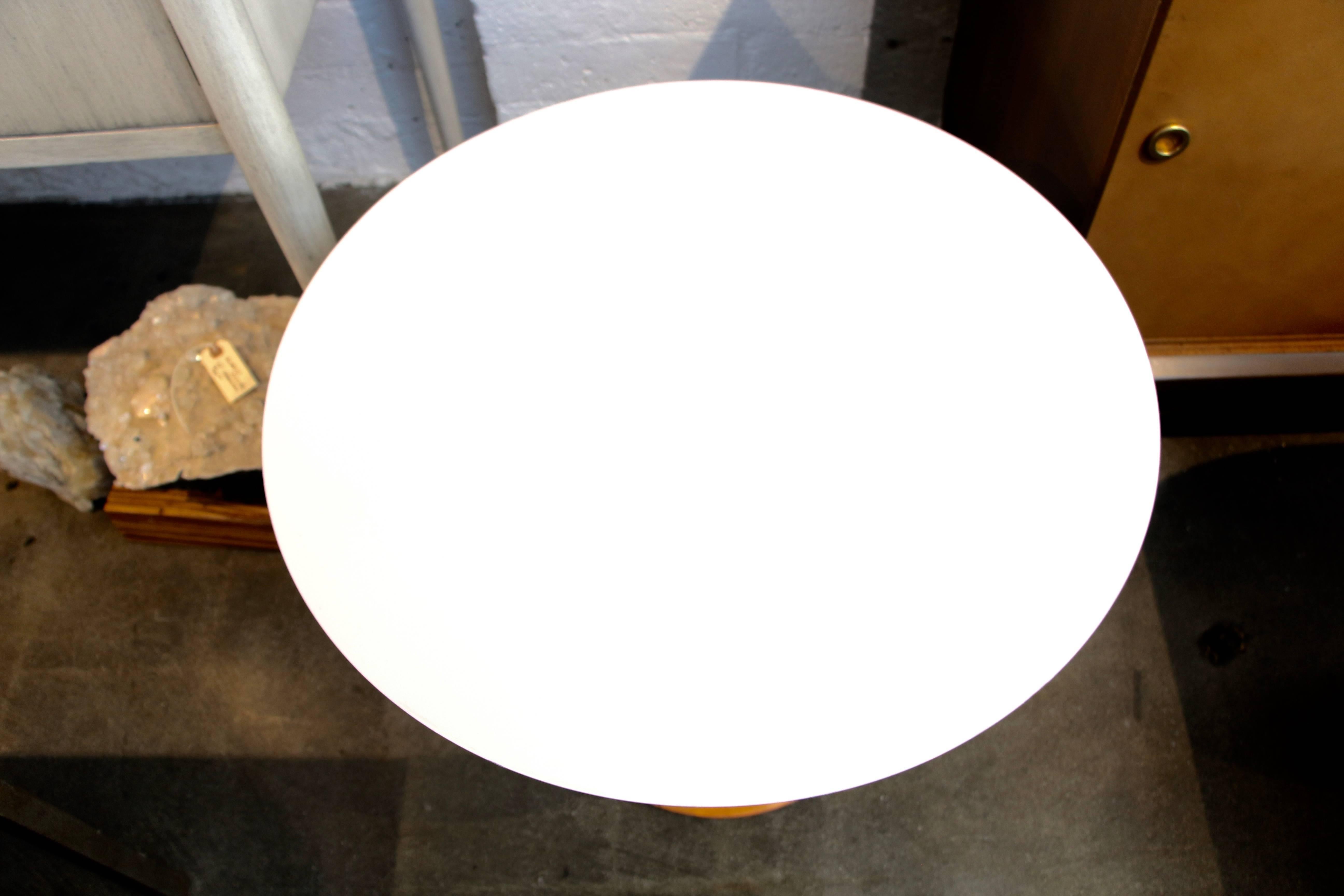 A Isamu Noguchi designed cyclone table in the smaller size or child's size. Still retains the Knoll paper label. The tabletop has been repainted and has a small edge imperfection, which is pictured.