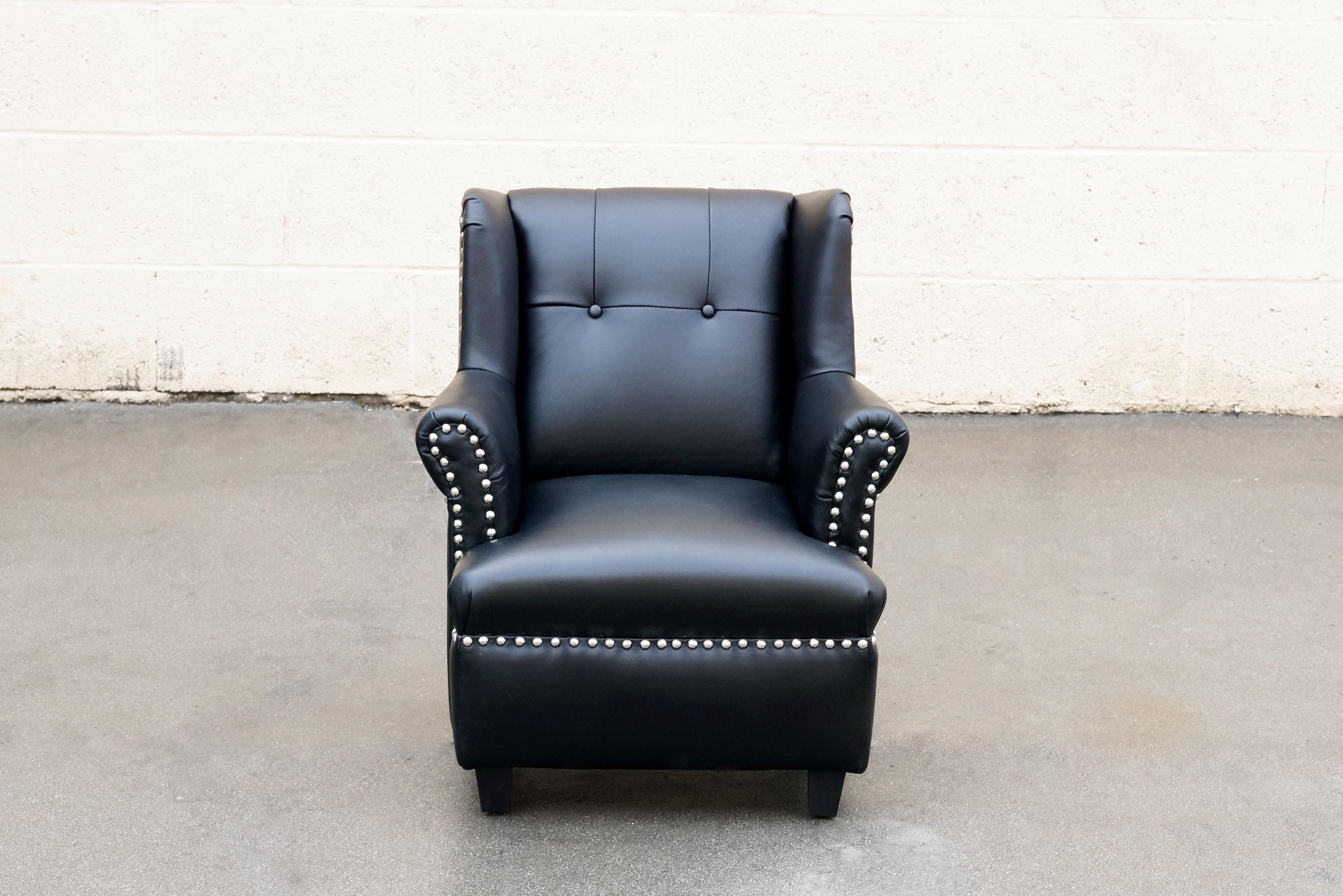 Your little one will be sitting in style in this vintage child'd wingback chair. Reupholstered in black leather with hammered chrome upholstery tacks. 

Dimensions: 22