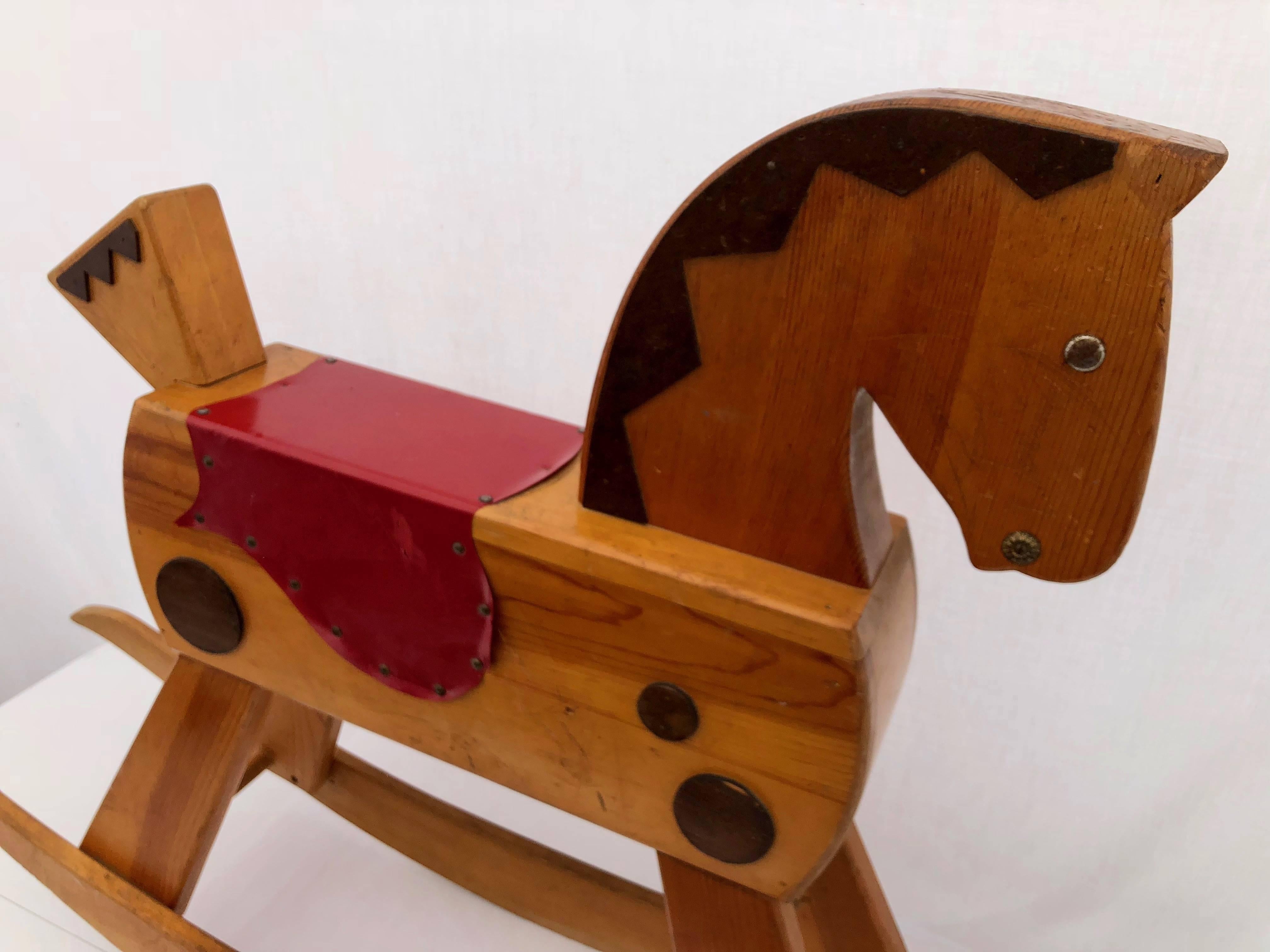 Hand-Carved Child's Wooden Rocking Horse with Footrest, Black Wood Mane and Red Saddle For Sale