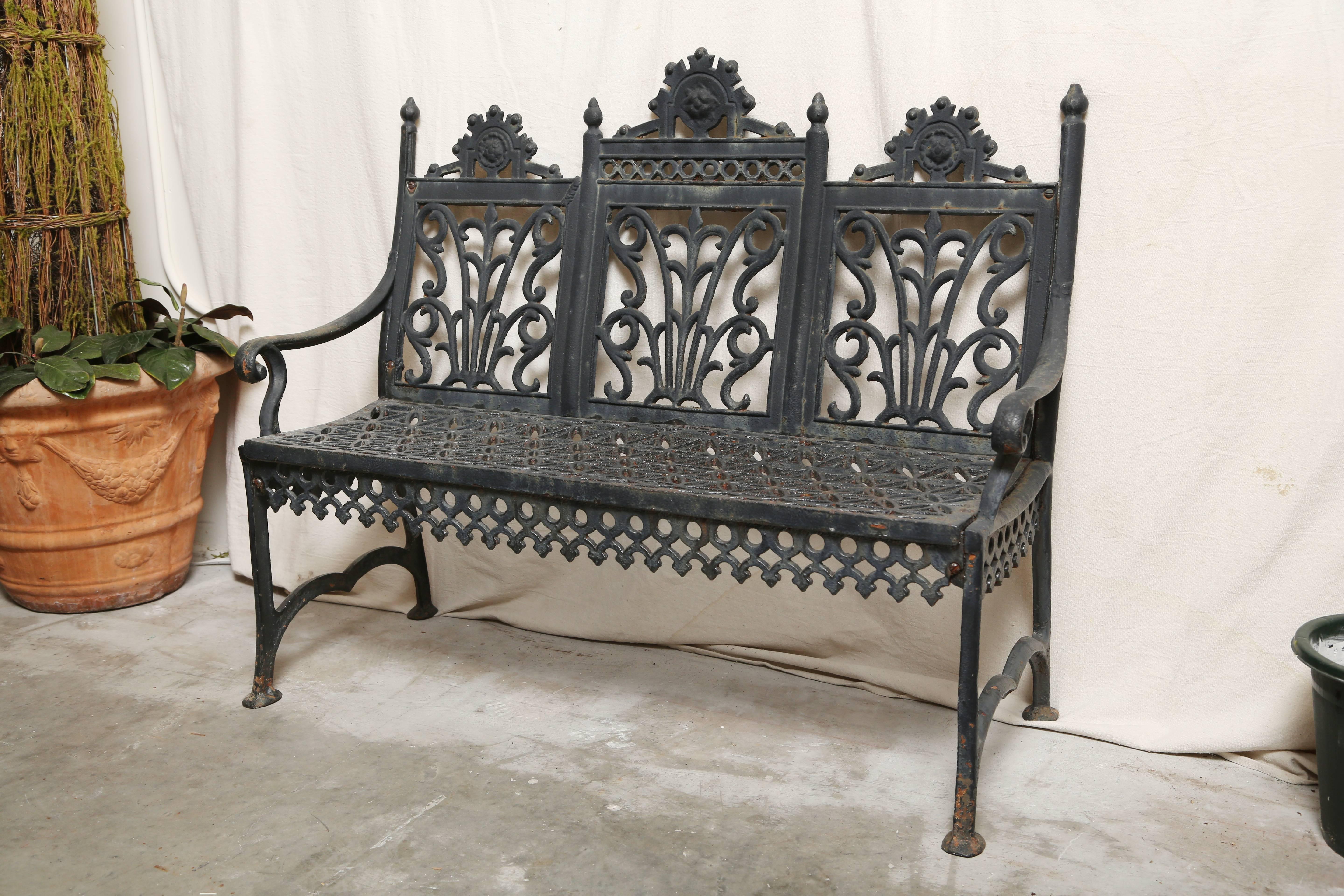Child's 19th century Victorian cast iron two armed bench. Seats two adults comfortably.  It is referred to as a curtain design garden settee by the Philadelphia foundry  Brines, Chase and Company who worked from 1880-95.
Measures: Seat height 15