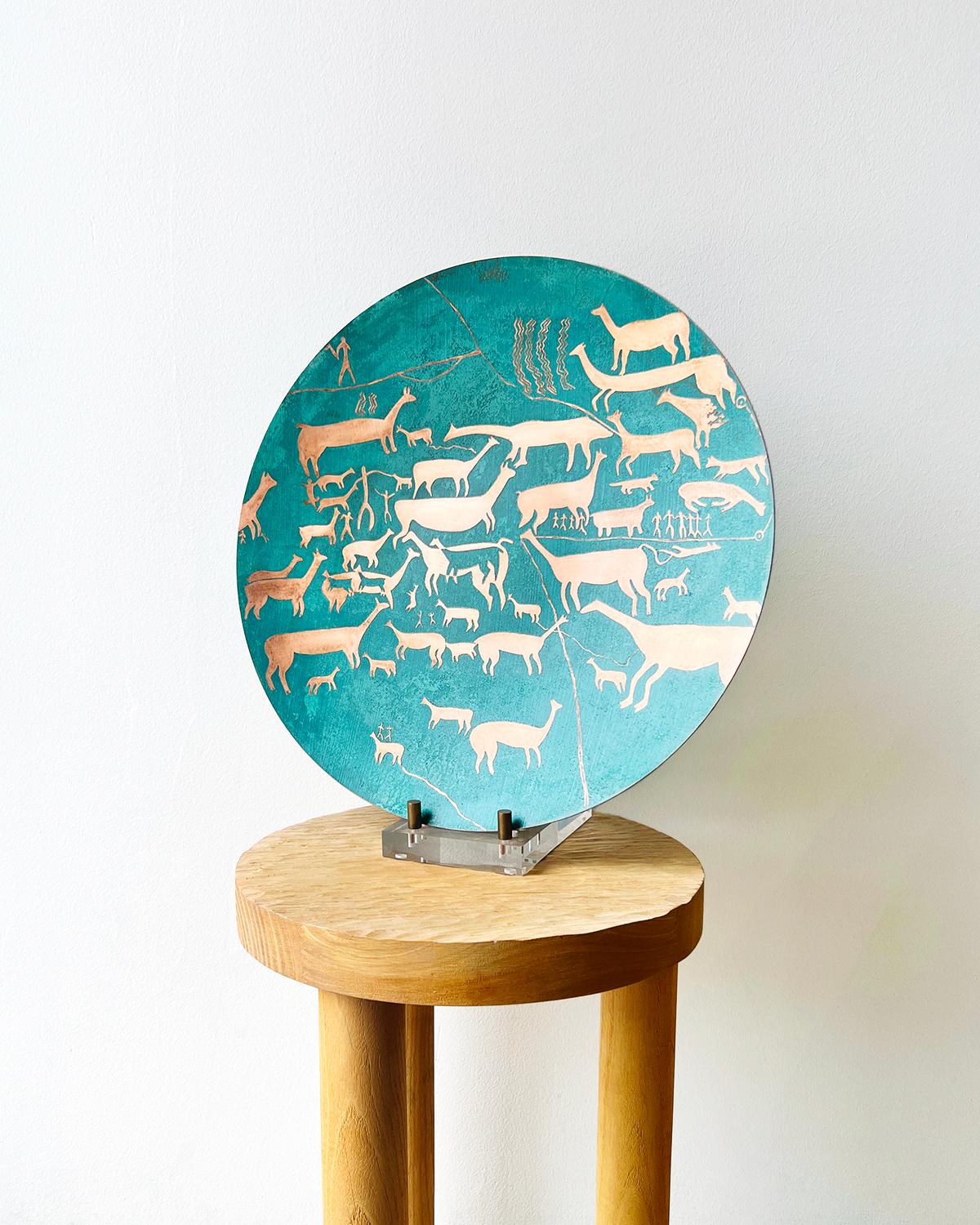 An etched copper platter with green patina
This Chilean Copper Ceremonial Platter is a handmade masterpiece of rustic beauty, featuring traditional etched animal figures and oxidized green patina. It offers an artisanal touch of indigenous art to