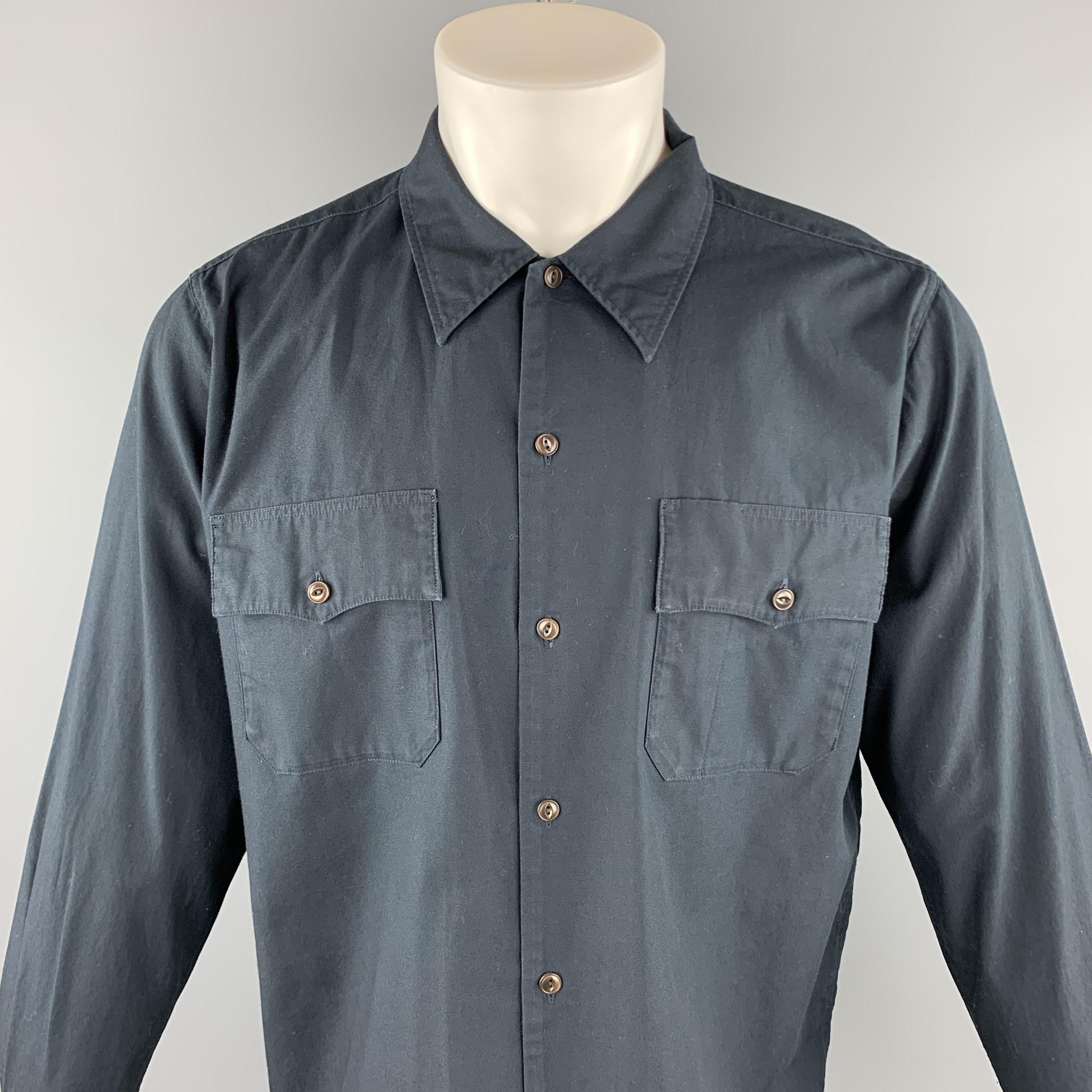 CHIMALA long sleeve shirt comes in a navy cotton featuring a button up style, patch pockets, and a spread collar. Made in Japan.

Excellent Pre-Owned Condition.
Marked: JP M

Measurements:

Shoulder: 17 in. 
Chest: 46 in. 
Sleeve: 25 in.
Length: 27