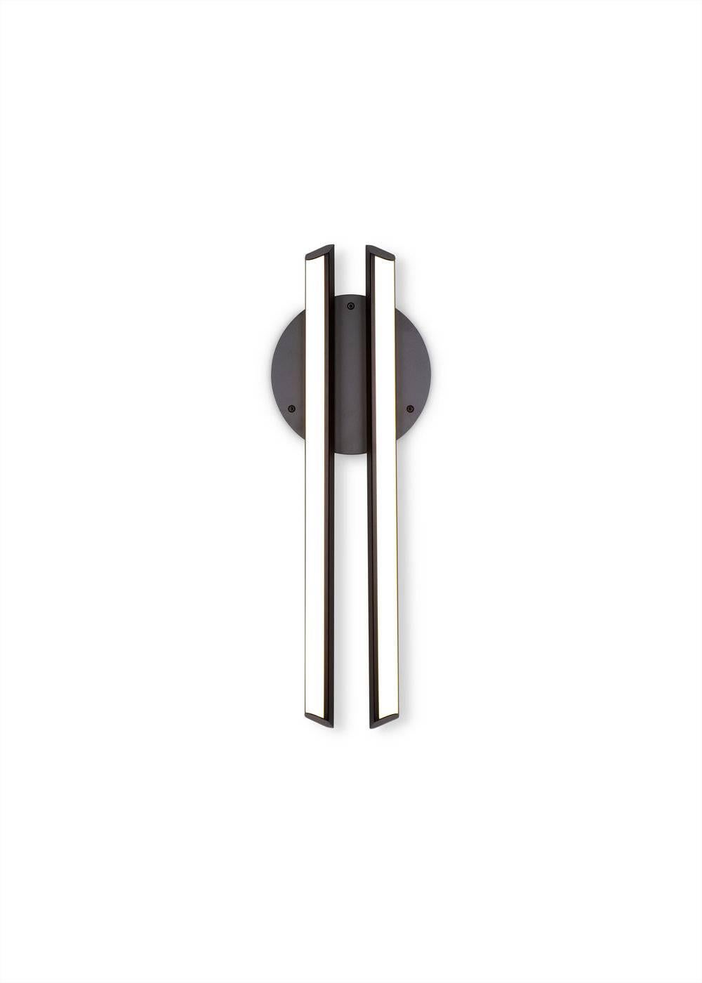 CHIME 23 sconce is inspired by the harmonious sound of resonating bells. CHIME features two parallel bars of soft warm light floating over a disc backplate. Available in two sizes, perfect for a hallway or vanity.

Metal Finish 
Powder-coat finishes