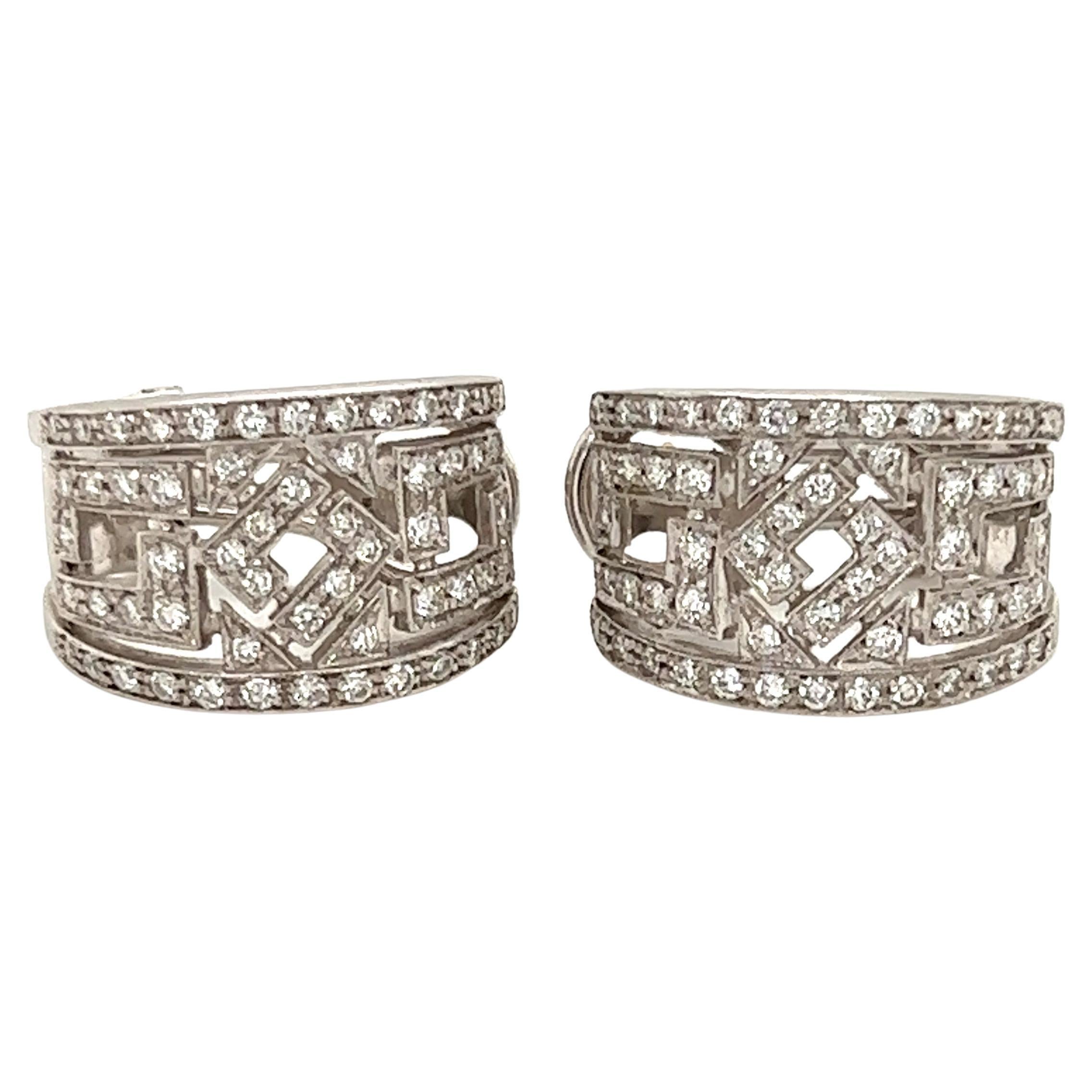 From Chimento featuring a beautiful open style design on half hoop earrings with post omega backs in the huggie style. Authentic and crafted from 18k white gold featuring a 13mm wide curved shape at the front set with sparkling diamonds, all