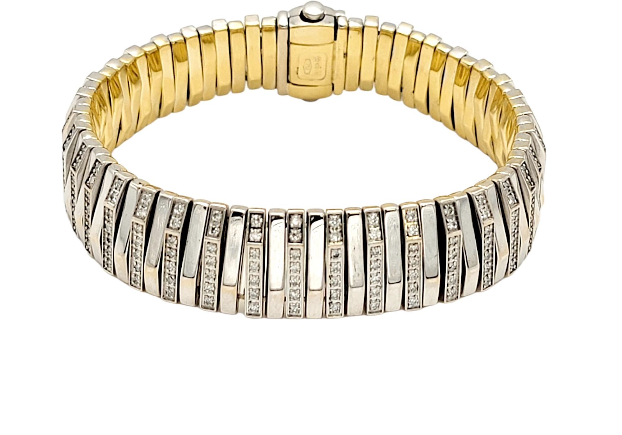 You will absolutely love this strikingly beautiful bracelet by Chimento. It is stunningly simple in design, with curved lines and glittering pave diamonds, making the piece absolutely glow! This lovely bracelet features a series of solid 18 karat